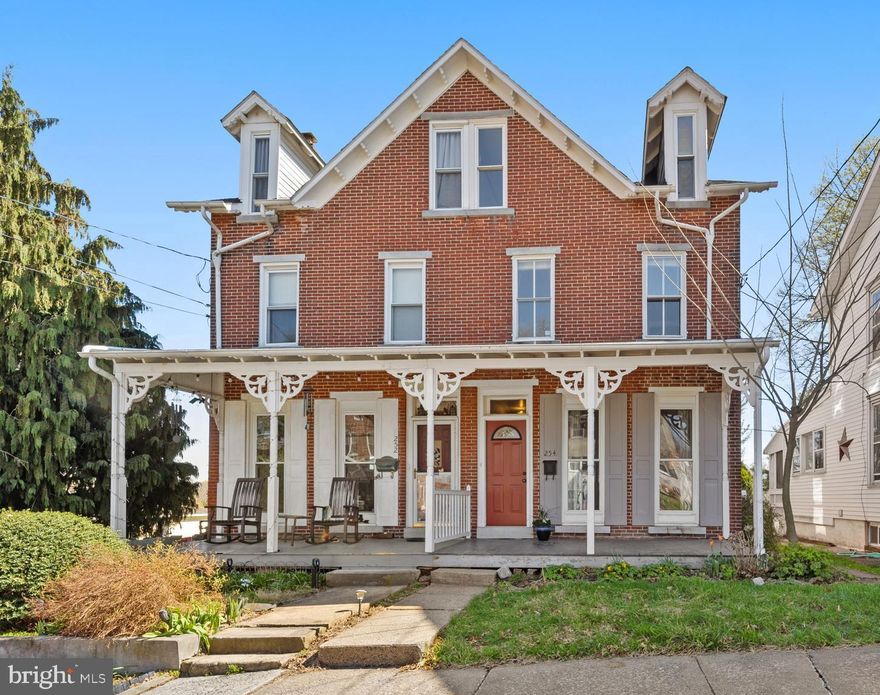 Charming brick Victorian twin features sunny, spacious rooms, a classic and timeless aesthetic, and original vintage details that make a house a home - lovely front porch with decorative Spandrel brackets,  stained glass window, nine foot ceilings on the main level, plaster walls, original wood banisters and newel posts and covered rear porch that accesses the side stone patio and backyard. The floorplan unfolds from the main level hallway, beginning with a flexible space with floor length windows that could be well utilized as an office, media room, crafting or play space.  Just down the hallway is the bright, generously-sized living room, featuring large west-facing windows that include stained glass, an original wood and glass door that accesses the side stone patio and an oversized opening into the gorgeous, sun-filled dining room.  The eat-in kitchen is adjacent to the dining room, ready for the next owner to refresh and lean into its vintage charm, or update as desired!  From the kitchen, access the rear covered porch, the side stone patio and yard beyond with storage shed for all your gardening supplies. The home stays warm in the winter months thanks to an upgraded furnace (new in 2021), and three separate heating zones to increase efficiency.  Other improvements include all new roofs in 2018, a new hot water heater in 2021, updated 200 amp electrical panel, and newer washer, laundry sink and sink pump.  Located in the award-winning Spring Ford Area School District, the home is situated in a lovely neighborhood of Spring City, near the top of the hill, with easy walkable access to the Brown Street Park and Spring City Swimming Pool just up the block!  So much to appreciate about this warm, well-loved property, as it beckons its next lucky owner.........