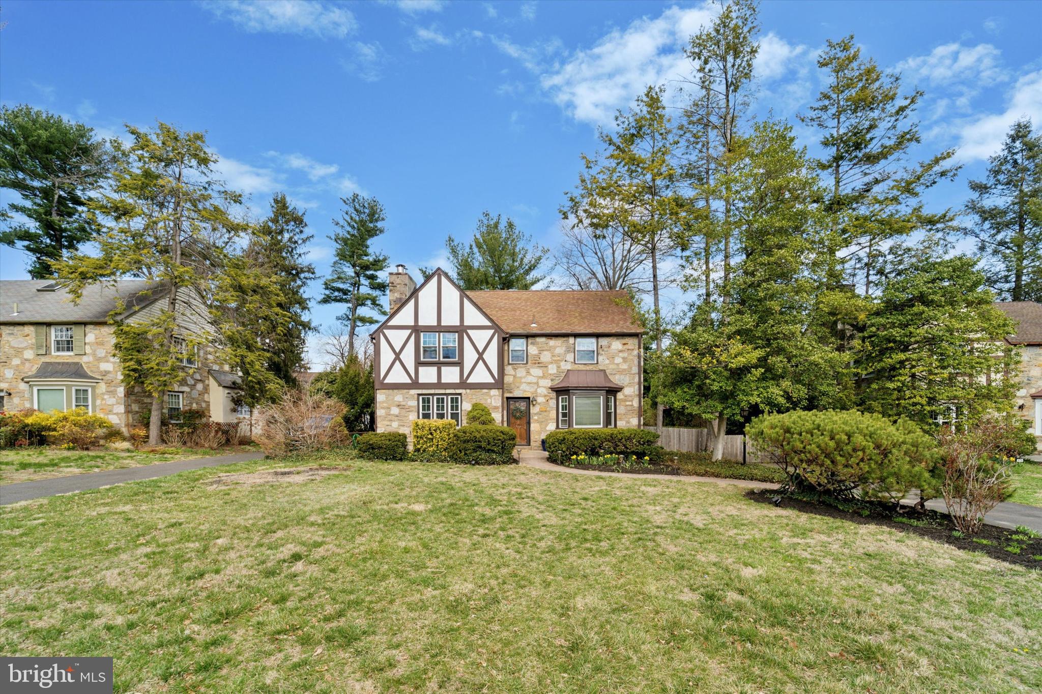 This charming 5 bedroom, 2.5 bath colonial is located on a beautiful tree-lined street in prestigious Elkins Park. As you approach the property, you’re captivated by its distinctive architectural details- timeless stonework, decorative half-timbering, and meticulously landscaped grounds. Once inside, you instantly appreciate the home’s cozy yet elegant charm. Boasting impeccably maintained hardwood floors, the sunny living/dining room is anchored by a stately fireplace while the den exudes a warm ambiance perfect for relaxing. The wow factor on the main level is the open concept kitchen. The eat-in kitchen features a large bay window, an oversized island, new cabinets, and Bosch appliances. It’s no doubt the kitchen is the “heart of the home”. Completing the main level is a powder room, which ensures privacy and comfort for all. Retreat to the second level to find a generous primary bedroom with en-suite, four spacious bedrooms each with ample closet space, and a hall bathroom. Moving to the lower level, the partially finished basement can be your media room, game room, gym, or home office. The possibilities are endless. The lower level also houses a very spacious laundry area offering additional storage and access to the outside. The outdoor space is a little oasis. Enjoy the custom swing set, gardening, outdoor dining, playing games in the fenced-in backyard or just unwind in the tranquil three-season room. With a two-car garage and long driveway, parking is a breeze. Attention Commuters! 929 Stratford Avenue is only a 5-minute walk to the Melrose Regional Rail Line and Myers Elementary. It’s minutes away from public transportation, Rt 309, PA Turnpike, supermarkets, theater, restaurants, shopping malls, Elkins Park Library, parks and downtown Philadelphia. Come tour this lovely home and make it yours!