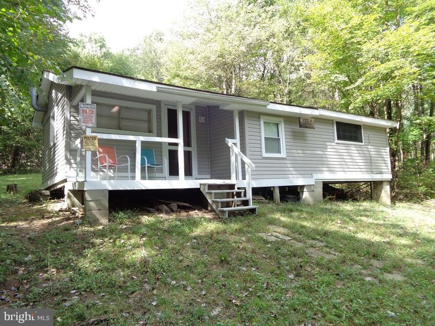 Small primitive cabin w/electric recently added located on 66+ acres that extends to peak of Jacks Mountain where 911 tower is located along Jacks Mountain Road.  Spring on property.  Pit privy (outhouse) no indoor plumbing.  Cabin is furnished with basic furniture, beds, appliances.  Has electric wall heater plus woodstove.,552 Sq.Ft., Cabin(Bldg1_Desc),Frame(Bldg1_Constr),Fair(Bldg1_Condition),Wood(Bldg1_Floor),Shingle(Bldg1_Roof)