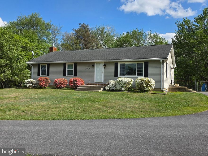 Spacious 3BR 3FB ranch home situated on a beautiful 1.32 acre level lot and backing to trees!  Updated eat-in kitchen with large island, primary suite with walk-in closet and private bath, very large living room with big picture window and beautiful sunset views.   Finished lower level features family room with woodstove, walk-out to large, level yard, large bonus room, and full bath.   Chair lift to basement (new last year) can convey if desired.  Big covered deck off the kitchen  is the perfect spot for morning coffee, outdoor entertaining or just relaxing at home.   Fenced area in rear yard, plus two sheds for storage.  Don't miss this fantastic Mt. Airy home, convenient to everything!!