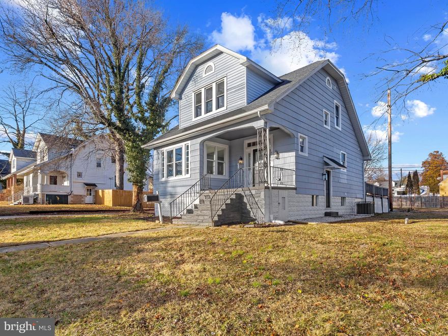 Welcome to this beautifully & Stunningly UPDATED porch front House with stylish finishes located in a well established neighborhood and sitting on a huge corner lot. A bright OPEN floor plan with modern amenities including an electric fireplace. The house offers 4 bedrooms & 3 Full bathrooms. The chef's designer dream kitchen offers QUARTZ Countertops / soft close shaker style cabinets, gorgeous backsplash & Stainless Steel appliances. New flooring throughout the house. New architectural shingles ROOF, New HVAC ,New HWH, New bathrooms with custom tile work & so much more. Recessed LED lights. Convenience has been taken to the next level with the first floor laundry hook up to make chores easy. Fully Finished Basement has a family room and a Bedroom and a Full Bathroom. HUGE backyard great for entertaining & summer BBQ’s. No detail has been overlooked. Tons of natural light. The private parking space in the rear is great for city living that has space for multiple cars. Close to Major Highways, Downtown, area malls and much more. A great home for all. This house is Move-In Ready with all-new flooring, carpeting & paint and is ready for immediate move-in. Don't Miss Out - Schedule Your Showing Today! ALL PERMITS PULLED.