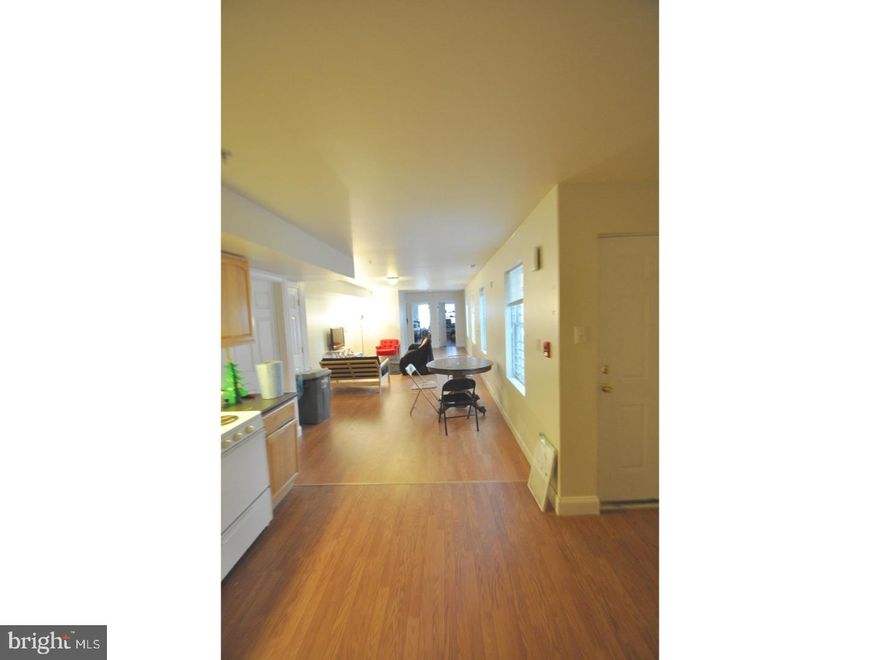 Becoming available in August (fall semester) is this extremely spacious and modern 1st floor apartment. This unit has exclusive access to the basement which is very large. It is unfinished but can still be used as a rec room or extra space. There is also a Washer and Dryer in the basement for tenants convenience. All three bedrooms bedrooms are spacious enough for full or Queen sized beds, a desk for studies, and TV set up. There is one bedroom in the front of the unit, two in the back. And all the common spaces ( Kitchen, Living, Dining, and bathrooms) are in the middle. This is designed well for roommates, and has direct access to the large shared back Patio. The unit is a newer construction with Laminate Hardwoods throughout and Marble Tiled bathrooms. Tenants are responsible for electric.