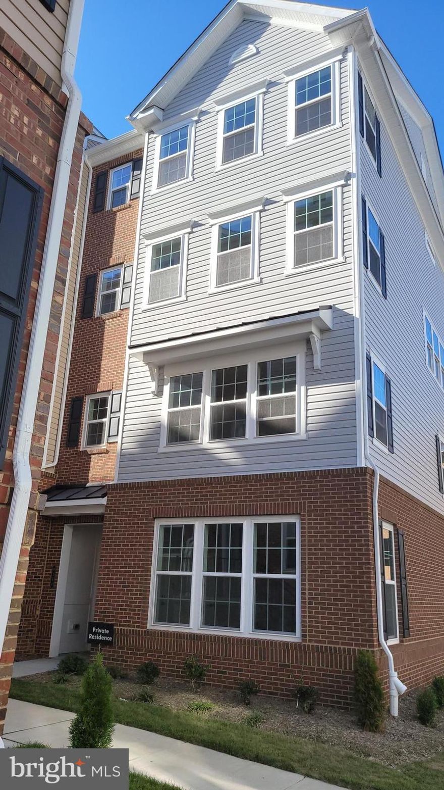 Don't miss this one! Never lived in, brand new condo unit ready for your personal decorating touches. Beautiful EOG top level unit with tons of upgraded amenities. Located at the Ballard Green Community in Owings Mills. Approximately 2,300 sq. ft. of living space with an open floor plan. The Gourmet style kitchen is located in the mist of the lower level with access to the dining and great rooms!  Top level offers conveniently located laundry room, and spacious size bedrooms. The primary suite features a large walk-in closet,  separate shower and soaking tub. Additional features: partial brick exterior, 1-car garage, oak-tread stairwells, box ceiling in the primary suite, spacious kitchen island with center sink, designer flooring in select rooms, back deck off the great room.