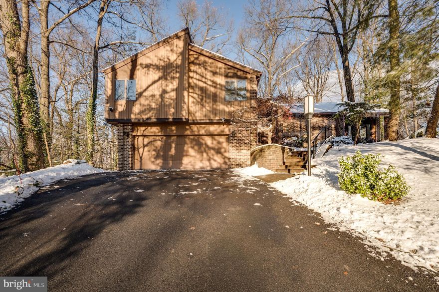 This property will make you feel like you're on vacation all the time. Located in Flying Hills, the home is surrounded by rolling trees and mountain views, offering a peaceful and scenic setting. 

Step into the inviting foyer and fall in love instantly. The first floor features an eat-in-kitchen with plenty of cabinet space, perfect for both everyday living and entertaining. Just off the kitchen is a combined living and dining area, highlighted by elegant ceilings, stylish light fixtures, and a cozy fireplace - an ideal spot to watch movies while enjoying the winter snowfall. 

This home offers four unique levels. At the top of the stairs, you'll find a very private primary suite complete with two office spaces, a walk-in closet and a primary bath. Down the hall is a conveniently located laundry area, two additional bedrooms and another full bath. 

Continue down past the first floor to the lower-level family room, which features a wood-burning fireplace and glass sliding doors overlooking the scenic landscape - perfect for curling up by the fire and enjoying the view. Down the hall is an additional half bath for convenience. 

Proceed down the final set of steps to the basement level, where you'll find additional flexible space. Keep the area as two rooms or convert it back into one room and add a bar or lounge - the possibilities are endless. This level also includes a separate utility room and an additional storage area.