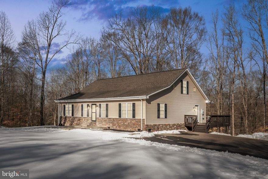 Welcome to 15285 Woodslane Road.  A rare opportunity to own 10.56 private, partially wooded acres, in an ideal commuter location!
Inside, the home offers a functional and inviting layout with comfortable spaces designed for everyday living. The updated Kitchen (2025) features 42 inch cabinets, granite countertops, and updated appliances.  The thoughtful floor plan includes a primary suite, two guest rooms, and a full bath all on the main level.  Upstairs offers a flexible space that would make a great rec room and additional code bedroom.
Outside, enjoy the peace of country living with established trails and a year around creek winding through the property.  The outdoor space is perfect for walking, exploring, or simply enjoying nature, all while being just minutes to I-95, Downtown Fredericksburg, Bowling Green,  the VRE, and Spotsylvania Regional Medical Center.  The fully paved driveway provides easy access and plenty of parking.  Car enthusiasts, or those that just need a little extra storage will appreciate the detached one-car garage, carport, and storage container.
With over 10 acres of land, a beautiful home, and a location that keeps you close to everything, this property offers the perfect blend of privacy, convenience, and practicality!