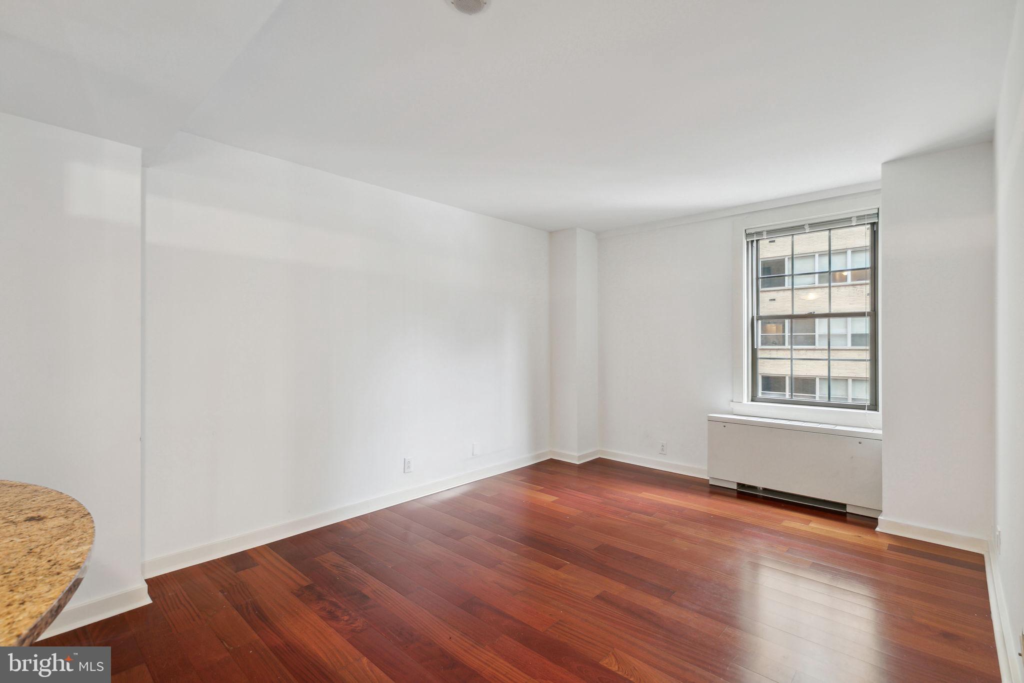Light-filled junior one bedroom with designer finishes at the desirable Parc Rittenhouse on Rittenhouse Square! This home features a living area with newly stained hardwood floors; a modern kitchen with stainless steel appliances, neutral cabinetry, granite countertops, and breakfast bar; a generously sized bedroom; and a marble-appointed bathroom with a shower/tub. Residents of Parc Rittenhouse enjoy world class amenities and services including a 24 hour doorman; an amenities suite with a state-of-the-art fitness center and resident lounge with pantry; media room; and an outdoor rooftop pool club with a large pool deck, full size pool, kids pool, and hot tub. Garage parking below the building for an additional fee (subject to availability).