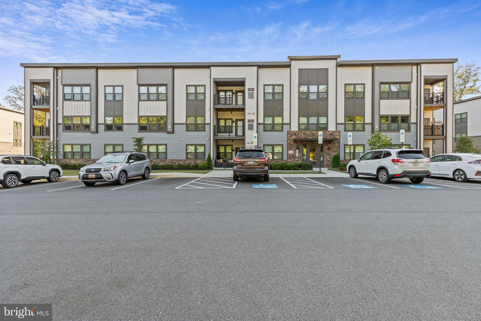 This beautifully designed 2023-built condo offers 1,217 square feet of thoughtfully planned living space, one of the larger floor plans available in the desirable Turf Valley community. This bright and inviting 2-bedroom, 2-bath home greets you with an open layout, warm recessed lighting, and luxury vinyl plank flooring that flows from the entryway into a spacious living area and gourmet kitchen.
The kitchen is the heart of the home, complete with a generous island accented by pendant lighting, soft-close cabinets, a gas range with stainless steel appliances, pantry storage, and a cozy breakfast nook. Both bathrooms feature stylish tile flooring, with the primary suite offering a spa-like retreat including dual sinks, a large walk-in shower with built-in shelving, and a roomy walk-in closet.
Located just minutes from Turf Valley Towne Square’s dining and shopping, Turf Valley Resort & Golf Course, and major routes including I-70 and Route 29, this condo combines style, convenience, and a serene setting.