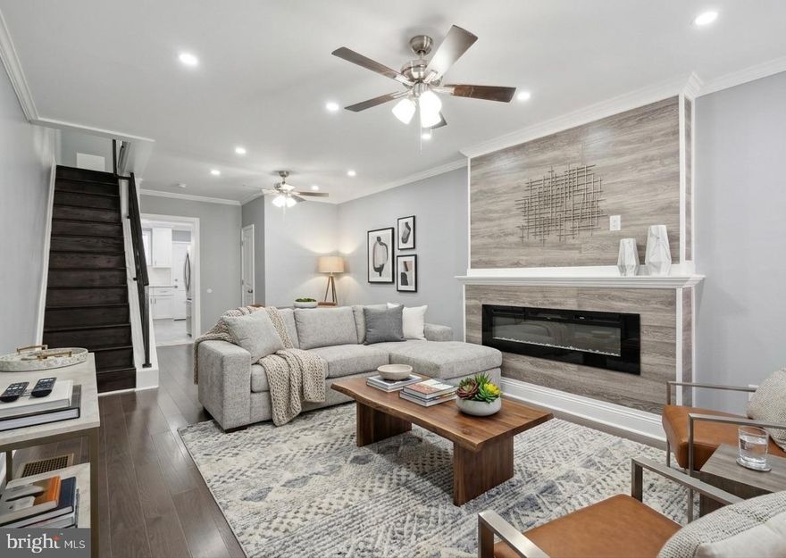 Welcome home to 2241 N Hancock Street a stunning three-story end-of-row townhome in the heart of Norris Square. This tastefully renovated property offers four bedrooms and a total of 1 full bathroom and 2 half bathrooms, ensuring convenience and accommodating your home office needs. The spacious living room, complete with a powder room, is not only inviting but also offers a cozy ambiance with an electric fireplace, perfect for chilly evenings and creating a warm atmosphere. This brand new renovation extends throughout the house, with gleaming hardwood flooring, a sleek stainless steel kitchen equipped with modern appliances, and chic white shaker cabinets for your culinary endeavors. Up the stairs to the second floor, you'll find two good sized bedrooms, providing space to use as bedrooms, office space, playroom and more! Down the hall, discover the epitome of convenience, the full bathroom offers modern features, frameless mirror, and equipped with both a tub with a shower and a separate stall shower. On the third floor, you'll find the third bedroom and the primary bedroom is a private haven, complete with an attached half bathroom. Discover endless possibilities in the partially finished basement – from a workout room to additional storage –  and laundry area complete with laundry*. Located just a block from the Norris Square park, and one block from the York-Dauphin station, enjoy the neighborhood amenities from shopping, to eating, entertainment and more, this home combines the charm of a dynamic neighborhood with the tranquility of your private oasis.