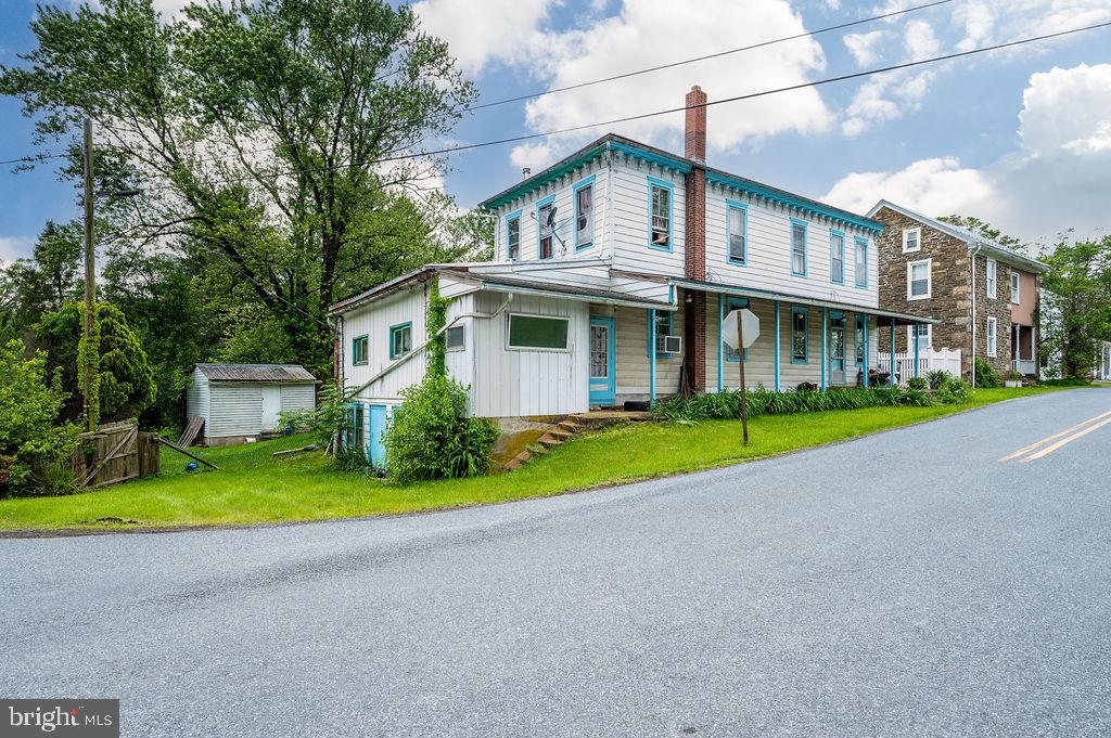 Let me know the last time you saw this large of a home at this price! Character. Charm. Historic. Close to shopping and restaurants yet still in the country. This home takes you back to a period when craftsmanship mattered. If you need space, this provides it! Large kitchen. Huge living room. High ceilings. Very nice back yard. This home needs some work but, in the end a buyer will have a cherished piece of Berks County history. Estate sale being sold as-is.