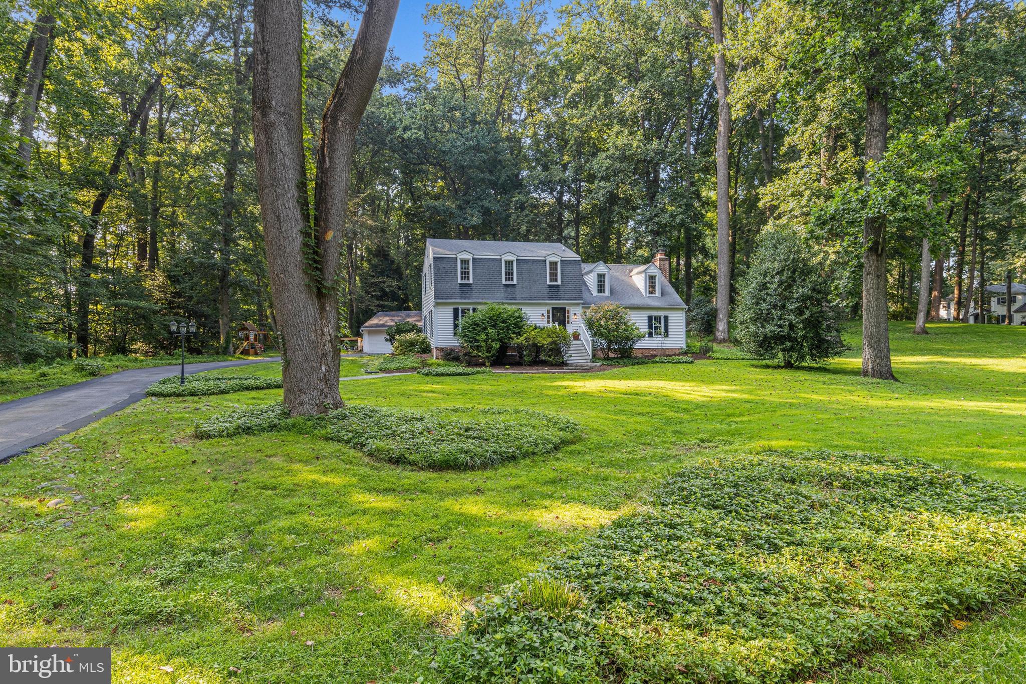 Set on over an acre of beautifully landscaped grounds in a quiet cul-de-sac, this exceptional 4 bedroom, 2 and half bath Colonial home offers the perfect blend of timeless charm and modern comfort—ideal for family living in one of the area’s most desirable school districts.
From the moment you enter, you’re welcomed by wide plank wood floors that flow throughout the main level, showcasing the home’s craftsmanship and inviting character. The spacious formal living room features custom trim and opens into a large dining room—perfect for holiday gatherings and everyday family meals.
The expansive, open-concept kitchen is a true showpiece, featuring rich cherry cabinetry, Corian countertops, tile backsplash, under-cabinet lighting, a center island with seating, a bar/serving area with custom glass cabinetry, stainless steel appliances, and a cozy built-in bench for casual dining. Additional details like wainscoting, ceiling beams, and recessed lighting enhance the warmth and elegance of the space.
Just off the kitchen is a functional mudroom with brick flooring, laundry area, and an oversized coat closet. The first floor also includes a stylish powder room and an oversized family room complete with a floor-to-ceiling brick fireplace, wood-burning stove, TV zone, wood ceiling beams, dual closets, and direct access to a two-tiered brick patio—perfect for entertaining or relaxing outdoors.
Upstairs, refinished oak flooring leads to four generously sized bedrooms, each equipped with ceiling fan/light combinations. The hall bath features an oversized vanity and tiled tub surround, while the primary suite offers three closets and an en-suite bathroom with a large walk-in shower and built-in bench.
The finished lower level adds flexible living space with carpet, wainscoting, recessed lighting, and built-in shelving—ideal for a playroom, home gym, or media room. In addition there is a "secret room" hiding behind the bookcase. A large unfinished area provides abundant storage and neatly houses mechanicals.
In addition, there is a 3- to 4-car attached barn-style garage, which is currently being utilized as an ultimate workshop, with still plenty of parking for all with an expanded driveway. Completing this stunning property is the welcoming walkway and lush landscaping . Located near Brandywine Museum of Art, Longwood Gardens, Chadds Ford Winery and the vibrant town of West Chester, this home offers privacy, convenience, and access to top-tier schools.
A rare opportunity to enjoy an exceptional home in a vibrant, family-focused community—this one is not to be missed!