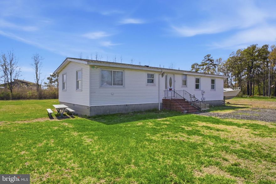 Great location for this older manufactured home near Rock Hall harbor. The house needs renovation and repairs, but the site offers a great location with nice views of North Point Marina and Rock Hall harbor. With three bedrooms and 2 baths on one-level living, this 1,200+ sq.ft. home would make a wonderful vacation or retirement home. The property is being sold as-is. Cleared, level lot. Additional lots are also available for sale