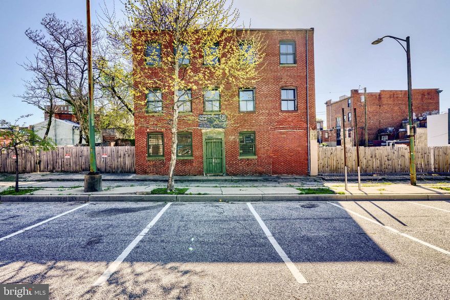 Nestled in the heart of the revitalized Hollins Market neighborhood, this exceptional parcel presents a rare opportunity in one of Baltimore City’s most dynamic areas. Located just half a block north of the newly renovated Hollins Market, the offering includes a spacious warehouse encompassing approximately 8,000 square feet, along with  23 S Carlton Street, and the possibility of buying 1101 Booth Street, 1103 Booth Street, and a .02-acre lot directly behind 23 S Carlton. Altogether, the property spans a generous .26 acres, making it one of the largest available parcels in this sought-after location. The area has seen significant rejuvenation over the past year, enhancing its appeal for investment and development. With its versatility, this property is well-suited for a range of uses, including storage, a distribution center, residential conversion, or mixed-use development. Whether you are an owner-user seeking a prime location or an investor looking for a promising opportunity, this parcel offers immense potential in a rapidly growing neighborhood.