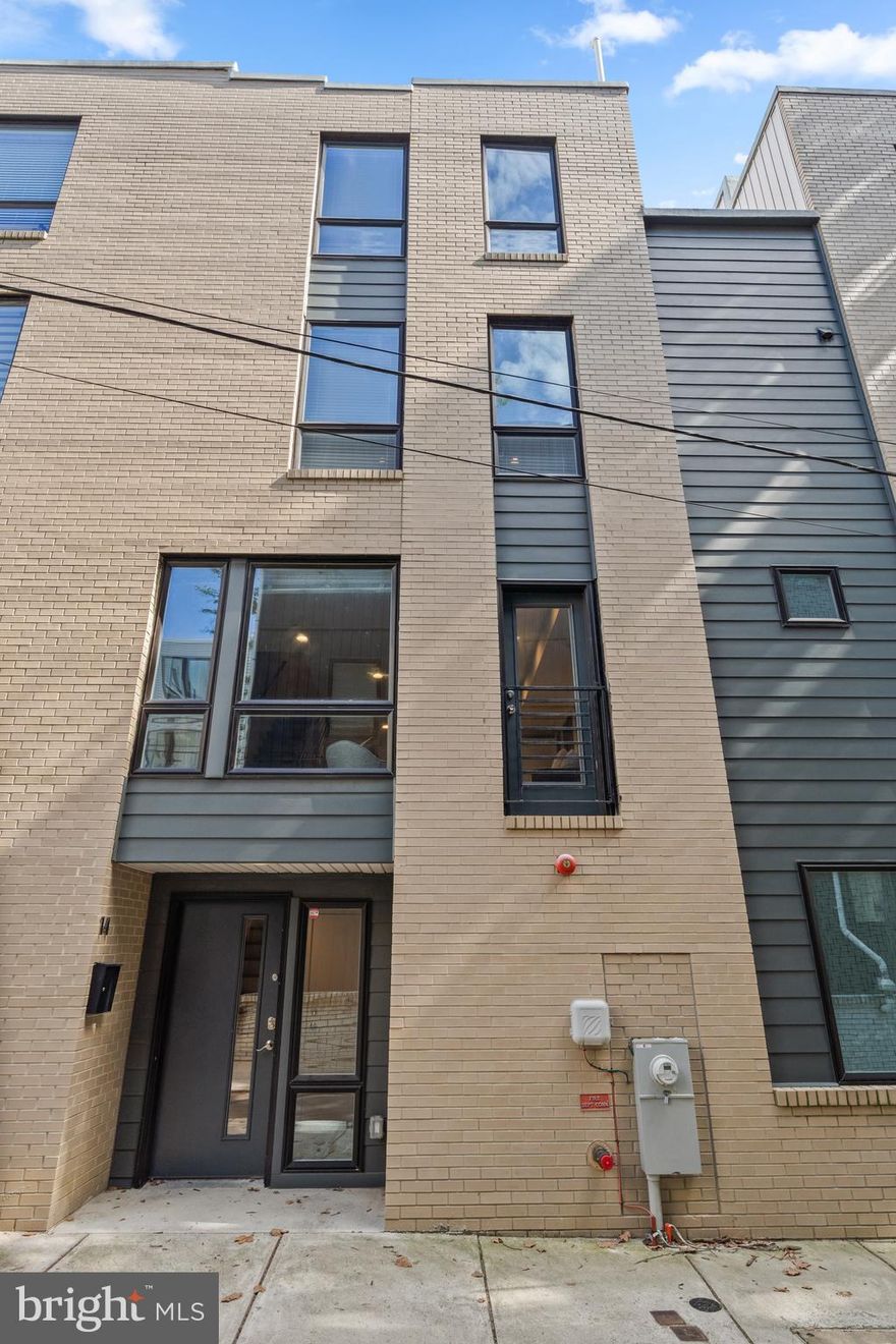 Welcome to 815 Perkiomen Street, Unit 14, a luxurious 3 bedroom, 2.5 bathroom townhouse with a full sized attached garage in the heart of Philadelphia's vibrant Fairmount/Francisville neighborhood!  This light-filled, modern home was recently built in 2020, and includes a green rooftop deck with gorgeous 360 degree views of the city skyline!  Walk into the main entrance of the home, and you will find a coat closet and powder room.  Continue up to the main living level and you will immediately be drawn to the abundance of natural light from the large windows.  The gourmet eat in kitchen is the heart of the home featuring custom wood cabinetry, quartz countertops, GE stainless steel appliances and a tile backsplash.  The large center island transitions beautifully to the main living area.  The main living area is all open concept, with access to the balcony, perfect for everyday living and entertainment.  The second floor boasts two bedrooms, a full bathroom with a bathtub, and a laundry closet.  The third floor is a private primary suite, including a full bathroom with a double vanity, an oversized shower with glass doors, and a linen closet.  And last but not least, ascend up the spiral staircase, to the amazing rooftop deck with spectacular views of Center City and beautiful sunrises and sunsets!  This home has beautiful finishes throughout including engineered hardwood throughout, an open riser floating staircase, and ample overhead lighting.  Take advantage of the walkability of this home, and the ultra convenient location just steps away from amazing restaurants, as well as playgrounds, the Art Museum, Fairmount Park and the Schuylkill River.  In addition, this property has about 5 years remaining on a 10 year tax abatement!  Do not miss this incredible opportunity to own this jewel box residence offering comfort, luxury and city living!