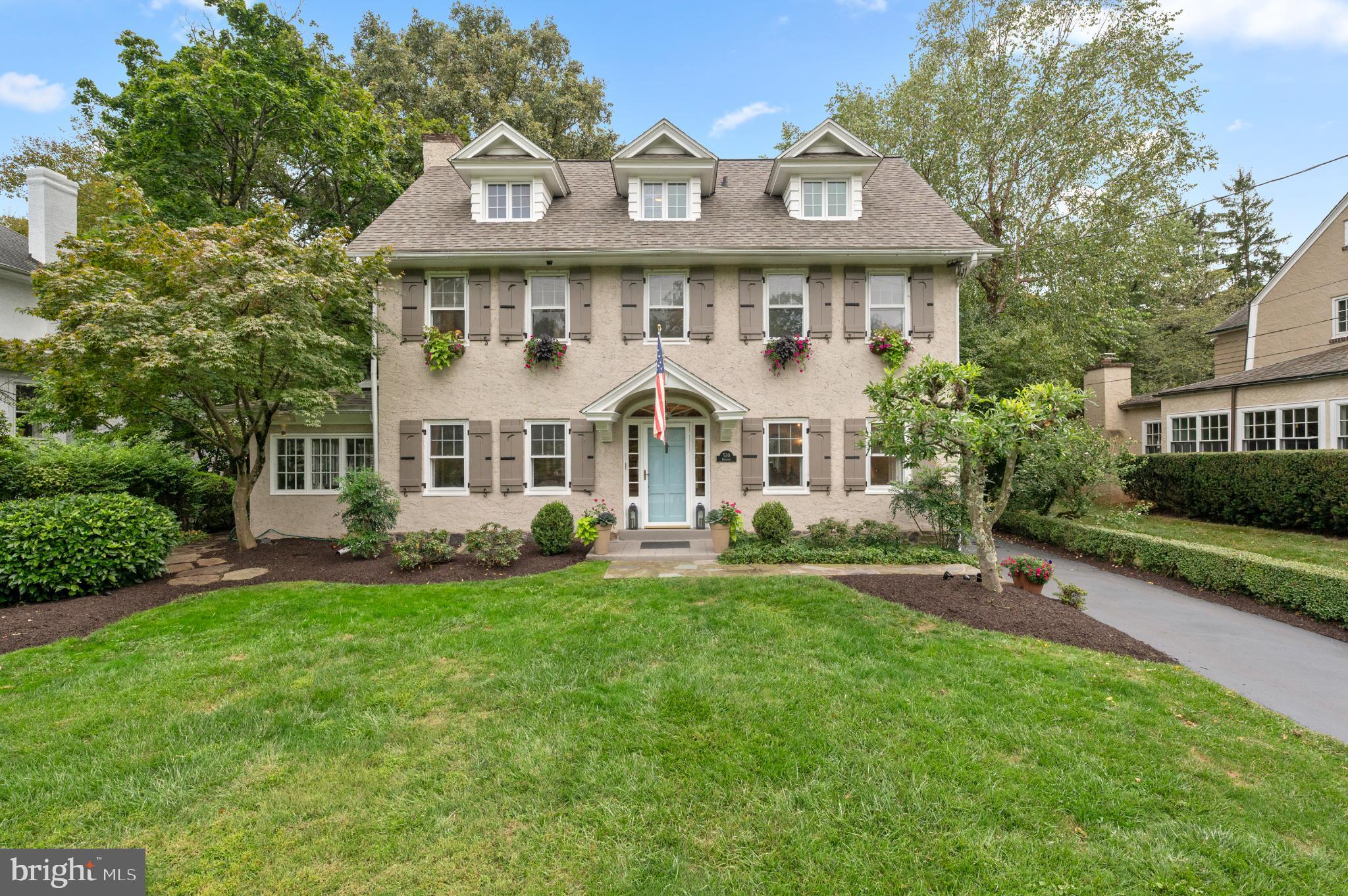 Walk to Wayne from this picture-perfect three-story colonial, tucked on a leafy side
street and brimming with historic charm, sun-filled spaces and modern amenities.
Set back from the road, the home’s well maintained and professionally
landscaped yard make a fabulous first impression. Step inside the light-filled foyer
and admire the intricate moldings, refined millwork, tasteful neutral paint and
hardwood floors throughout. Just off the foyer, a warm and inviting family room
with wood-burning fireplace connects to a skylit sunroom with slate flooring.
French doors open to a cozy sitting room with custom built-ins and sweeping bay
window overlooking the tree-lined backyard. Steps away the pristine eat-in kitchen
shines with newer appliances, center island, double wall oven with warming
drawer and updated flooring. A gracious dining room—ideal for gatherings large
or small—and powder room complete this seamless first floor. Upstairs you’ll find
hardwood floors throughout, plus an expansive primary suite with separate sitting
room and ensuite full bath refreshed with newer flooring and double vanity. Two
secondary bedrooms (one with a lounge area), a full hall bath and laundry closet sit
just down the hall. The third floor delights with two additional bedrooms featuring
new dormer windows and a full hallway bath with newer glass shower. The
unfinished lower level offers ample storage and a secondary laundry space.
Outside, enjoy a rear flagstone patio, flourishing greenspace and gardens
and detached two-car garage. In addition, this home offers a new roof. Homes in this coveted community enjoy award-winning Radnor schools plus walkability to the Radnor Trail, Encke Park, two train
stations and all the events, festivals, shops and restaurants of vibrant downtown
Wayne. Don’t delay; seize this chance to own a turnkey Radnor gem today!