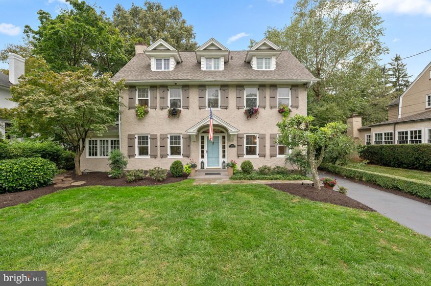 Walk to Wayne from this picture-perfect three-story colonial, tucked on a leafy side
street and brimming with historic charm, sun-filled spaces and modern amenities.
Set back from the road, the home’s well maintained  and professionally
landscaped yard make a fabulous first impression. Step inside the light-filled foyer
and admire the intricate moldings, refined millwork, tasteful neutral paint and
hardwood floors throughout. Just off the foyer, a warm and inviting family room
with wood-burning fireplace connects to a skylit sunroom with slate flooring.
French doors open to a cozy sitting room with custom built-ins and sweeping bay
window overlooking the tree-lined backyard. Steps away the pristine eat-in kitchen
shines with newer appliances, center island, double wall oven with warming
drawer and updated flooring. A gracious dining room—ideal for gatherings large
or small—and powder room complete this seamless first floor. Upstairs you’ll find
hardwood floors throughout, plus an expansive primary suite with separate sitting
room and ensuite full bath refreshed with newer flooring and double vanity. Two
secondary bedrooms (one with a lounge area), a full hall bath and laundry closet sit
just down the hall. The third floor delights with two additional bedrooms featuring
new dormer windows and a full hallway bath with newer glass shower. The
unfinished lower level offers ample storage and a secondary laundry space.
Outside, enjoy a rear flagstone patio, flourishing greenspace and gardens
and detached two-car garage.  In addition, this home offers a new roof.  Homes in this coveted community enjoy award-winning Radnor schools plus walkability to the Radnor Trail, Encke Park, two train
stations and all the events, festivals, shops and restaurants of vibrant downtown
Wayne. Don’t delay; seize this chance to own a turnkey Radnor gem today!