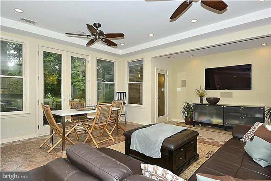 Charming exterior conceals huge addition with all of the bells and whistles. Dramatic open spaces including a chefs kitchen, informal family room and boasting vistas of the large private and wooded backyard.  This flexible layout would be perfect for those with a home office (private entrance) in-laws or au-pair.