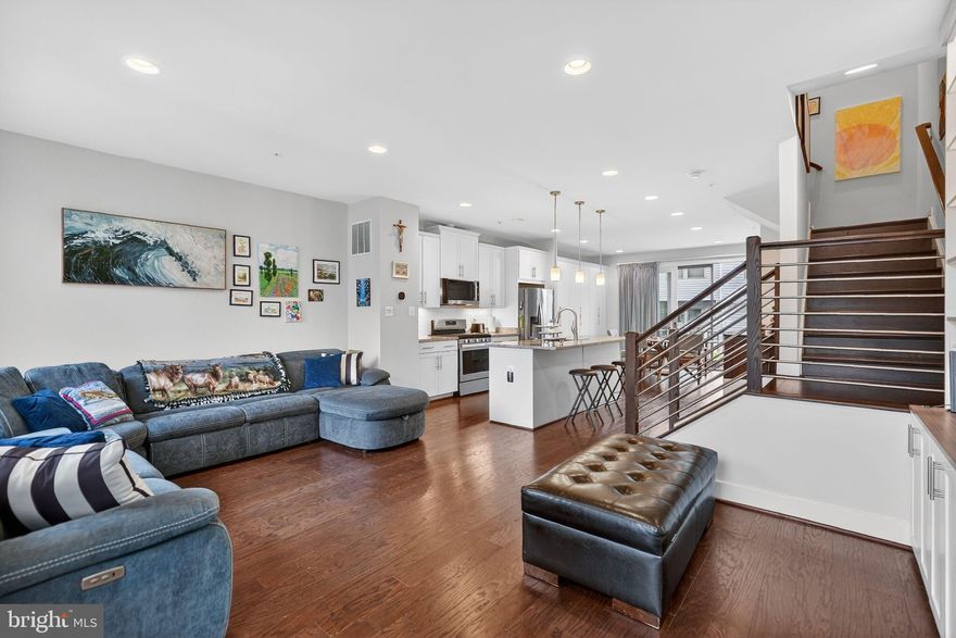 JUST REDUCED.  Four true bedrooms!  Luxurious and sophisticated, this 6 years young 3 story townhome offers a great location close to Metro, major transportation routes and many amenities. 

Gourmet chefs looking for the perfect kitchen will find it in the granite and stainless kitchen with its abundance of cabinet and counter space. Serve morning coffee at the center island while the dining area is perfect for more formal meals. Either way, the natural light, high ceilings with recessed lighting, and open concept offer ambiance and relaxation. A powder room is conveniently located on this level. 

The primary bedroom includes a large, customized walk-in closet with built-ins, as well as open shelving, and the sumptuous primary bathroom has a built-in bench in the shower and double sinks. The 2 additional bedrooms, one with a walk-in closet and the second with a double closet, a second full bathroom, and laundry complete this level. The fourth bedroom with an ensuite full bath is located on the entry level and also could be a multi-purpose room, family room or home office.Hardwood floors, neutral decor and six panel doors are some of the fine features, and a deck and 2 car garage with EV charger complete this picture perfect home.  A few steps away is the playground/tot lot.