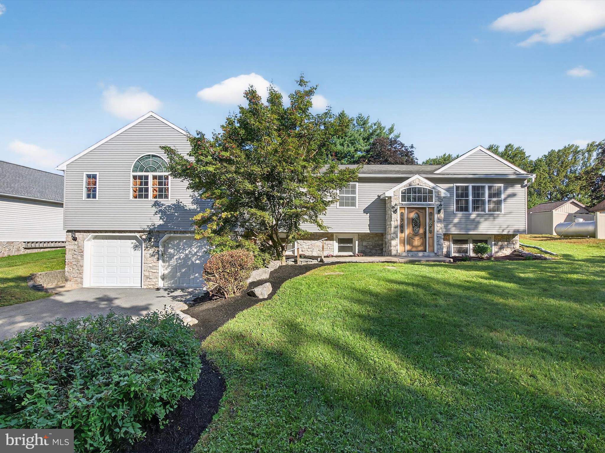 This truly unique property has up to seven bedrooms total, 4 1/2 bathrooms, a six+ car garage and a spacious, partially fenced backyard. The home has been lovingly updated and cared for, with two full kitchens, and is set up in a way that it can be used as one cohesive home or three separate living spaces with three private entrances.
The main section of the home has three full bedrooms, two full baths and a large great room with vaulted ceilings. The great room connects to the full in-law suite, large bedroom with walk-in closet, full bathroom with washer/dryer hookup and living space with a full kitchen and back entrance to the fenced in portion of the yard.
The lower level has a third owner's suite with walk-in closet and full bath with heated floors. A living area with fireplace, half bath, laundry, bonus room that can be used as a nursery or office, direct access to the 6 car garage/workspace and a private entrance from the backyard.
Car lovers dream with a six+ car garage and room for at least six more vehicles in the driveway. Garage includes air compressor with air hose distribution system, built in workshop shelving and extra storage space. The backyard is stunning with a stamped concrete patio, plenty of flat play space and a separate fenced in area for your pets.
This home truly has it all and must be seen in person to be appreciated. See floor plans at the end of photos. Showings start Thursday September 4, schedule today.