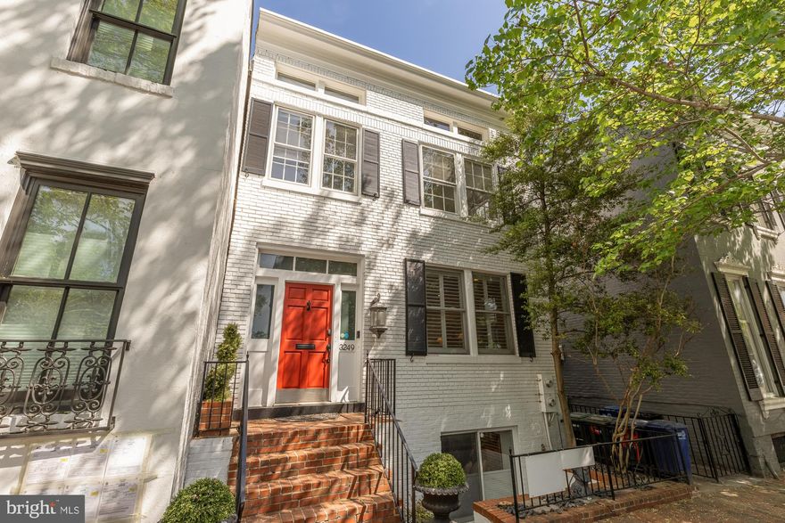In the storied enclave of Georgetown — where cobblestone streets meet centuries of American history — 3249 P Street NW stands as a rare and considered residence, one that honors the architectural soul of the neighborhood while embracing every expectation of contemporary luxury.
Thoughtfully refined over the years, the home reflects a continued commitment to quality — a new roof, updated HVAC system, and beautifully upgraded floors among the most notable improvements. Each update has been made with care and intention, preserving the home’s historic character while elevating every dimension of modern comfort.
At the heart of the residence, the chef’s kitchen is a study in quiet sophistication — integrated Miele appliances, bespoke cabinetry, and an open, luminous layout conceived for the art of entertaining. The principal living room, anchored by an elegant fireplace, offers warmth and proportion in equal measure, its atmosphere flowing naturally toward the home’s most private sanctuary: a walled rear patio and 16x14 pool framed by mature greenery and aged brick. This sequestered garden retreat — rare in its scale and serenity for the city — invites long summer evenings and unhurried weekend mornings with the ease of a countryside estate.
Above, soaring ceilings and a generous array of skylights and south-facing windows bathe the upper level in extraordinary natural light. The primary suite is a study in restorative calm, appointed with a spa-caliber bath of high-end fixtures, hand-selected tile work, and finishes chosen with the discerning eye of a designer who understands that true luxury is personal. A bespoke steam shower completes the experience — an unhurried ritual of restoration that transforms the morning routine into something altogether more considered.
A separately metered lower level extends the home’s versatility further still — an ideal canvas for a distinguished guest suite, private study, or income-generating residence.
To live at 3249 P Street NW is to inhabit one of Washington’s most coveted addresses at its fullest expression. The boutiques and celebrated tables of M Street and Wisconsin Avenue — among them Café Milano, Martin’s Tavern, and Kafe Leopold — are mere steps away, as are the C&O Canal Towpath and Georgetown Waterfront Park, where the Potomac’s edge offers a rare counterpoint of natural beauty within the city’s most dynamic quarter.
This is not simply a home. It is a standard of living.​​​​​​​​​​​​​​​​