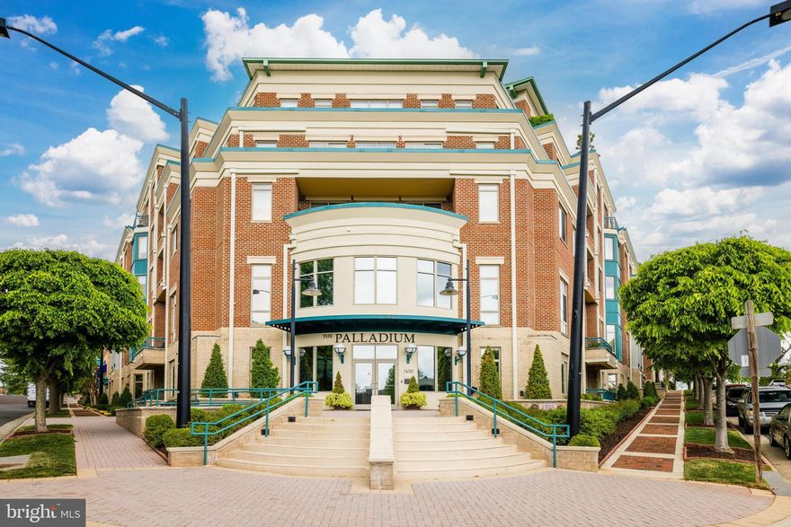 Welcome to The Palladium! Luxury Living at its finest. A sought-after condominium in the Heart of downtown McLean. Walk to dining, shopping, and restaurants. StarNut cafe below is perfect to mingle with others over a cup of Java or Italian Gelato! This stunning 2 Bedroom, Large Den, 2 bath unit is unique - it's a corner unit next to the elevator. The Main Bedroom is huge with a walk-in closet. The Second Bedroom has a private full bathroom, wonderful for a guest suite. While the Den, with built in shelves, is ideal for a library or home office. The Chef's Kitchen is ideal for entertaining. This light-filled unit with gleaming hardwood floors and custom Fresh Paint throughout, has been very well maintained and cared for. The open living area boasts high ceilings, and a Gas Fireplace that overlooks a grand private Terrace, making this unit highly desirable! The Terrace has a private door leading to a large open garden area for lounging and enjoying nature.