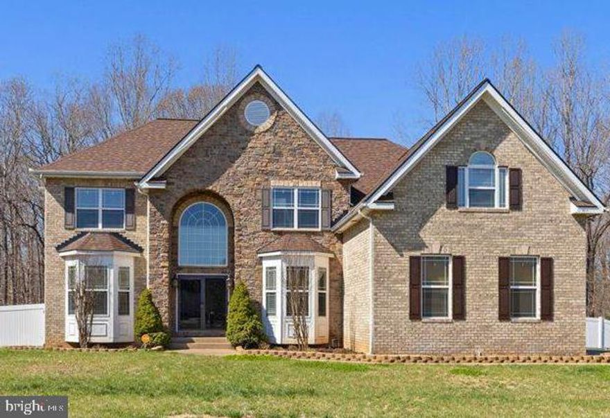 Beautiful 6,600+ sq. ft. brick & stone colonial on 3  acres in Naylor’s Reserve. Custom‑built by Litz Custom Homes, this property features a grand arched entry and a side‑load garage. Inside, Brazilian hardwood floors lead to a stunning two‑story family room filled with natural light. The gourmet kitchen offers a large island, double wall ovens, upgraded counters, and abundant cabinetry, and it opens to the breakfast area and main living spaces. With 6 bedrooms and 4 full baths, including a main‑level bedroom/office suite, the layout is ideal for guests or multigenerational living. The upper‑level primary suite provides a spacious retreat with a luxury bath and generous closets. A fully finished basement adds exceptional living space with a dedicated theater room and room to expand your lifestyle.