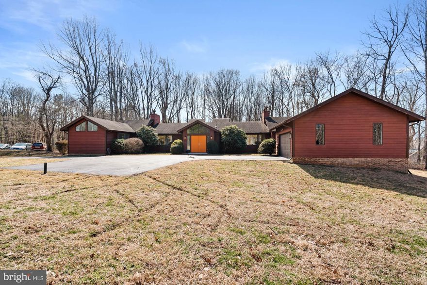 Sited on a sprawling 2.1 +/- acres in picturesque Potomac, MD, this six bedroom five full bathroom home featuring an expansive terrace overlooking the private outdoor pool. Needs work but bright and filled with opportunity.

Beautifully constructed for a plethora of natural light, including stunning skylights and multiple sets of sliding glass doors, this well-maintained home boasts modern light fixtures, two fireplaces, and soaring vaulted ceilings. A gracious, dedicated foyer welcomes you to the sweeping first floor, where each room brings a connection to the outdoors for everyday living. With 4,800 +/- square feet, the distinctive floor plan allows for various types of entertaining and enjoys multiple glass doors to the rear deck with mature tree top views. The spacious family room with Cathedral ceilings is anchored by a handsome fireplace and is conveniently located off of the eat-in kitchen. Mornings are cheerful in the sun-drenched, table space kitchen flooded with natural light from the skylight and wall of glass doors. The living room leads to the formal dining room, which features hardwood floors, and a stunning light fixture. A first-floor primary bedroom offers dual closets and an en suite bathroom. There is also a library with built-ins (and a full bath) off of the primary bedroom, creating a private retreat. Three additional bright and cheerful bedrooms, as well as two full baths, are located on the opposite side of the main level. An attached two-car garage adjacent to the convenient first-floor laundry room creates superb flow in the home.

The sizable walk-out lower level features ample storage, the fifth and sixth bedroom with a full hall bath, and a huge recreation room with a wet bar and rear terrace access to the gorgeous outdoor pool. A private backyard enhances the dramatic grounds with its multi-tiered gathering areas. Other amenities include a storage shed and a greenhouse. 

11416 Spur Wheel Lane enjoys a tranquil setting with ample opportunities for outdoor recreation and relaxation, yet it has easy access to nearby schools, shopping centers, restaurants and major transportation routes, including I-270, I-495, and the Metro.