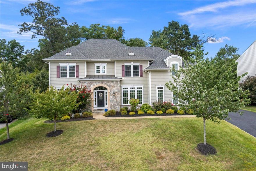 This is the home you've been waiting for! Very rarely does a property with the unique combination of a truly magnificent home, large lot, and premier setting come available. To say the home is stunning is an understatement. Highlighted by dramatic two story entry foyer with custom double staircase, open and airy floor plan, family room featuring 20 foot high ceilings, upgraded trim detail throughout, spacious primary suite, and incredible screened in porch overlooking private rear grounds. Other special features include: 5 bedrooms, 4.5 baths, over 6,000 total square feet, wide plank flooring, extensive recessed lighting, expansive thermal windows & glass doors, and additional back staircase to upper level. The dream Kitchen features custom wood cabinetry, gas cooking, large island, and spacious pantry. The finished lower level features a family room with tons of natural light thanks to double door area way egress, bedroom with full bath, and an additional 800 sq ft of storage/bonus room ideal for converting into a gym/theater/golf simulator/etc! More than ample parking is provided by 2 car garage and expanded asphalt driveway. The outdoor scene is enhanced by custom 20ft x 16ft screened porch and 16ft x 12ft open deck both made of "Trex" for maintenance free upkeep! The home's attributes are enhanced by its fabulous location on a quiet cul-de-sac in waterfront community that offers private Potomac River access to its residents. Truly special home impeccably maintained in exceptionally attractive location that checks all the boxes!