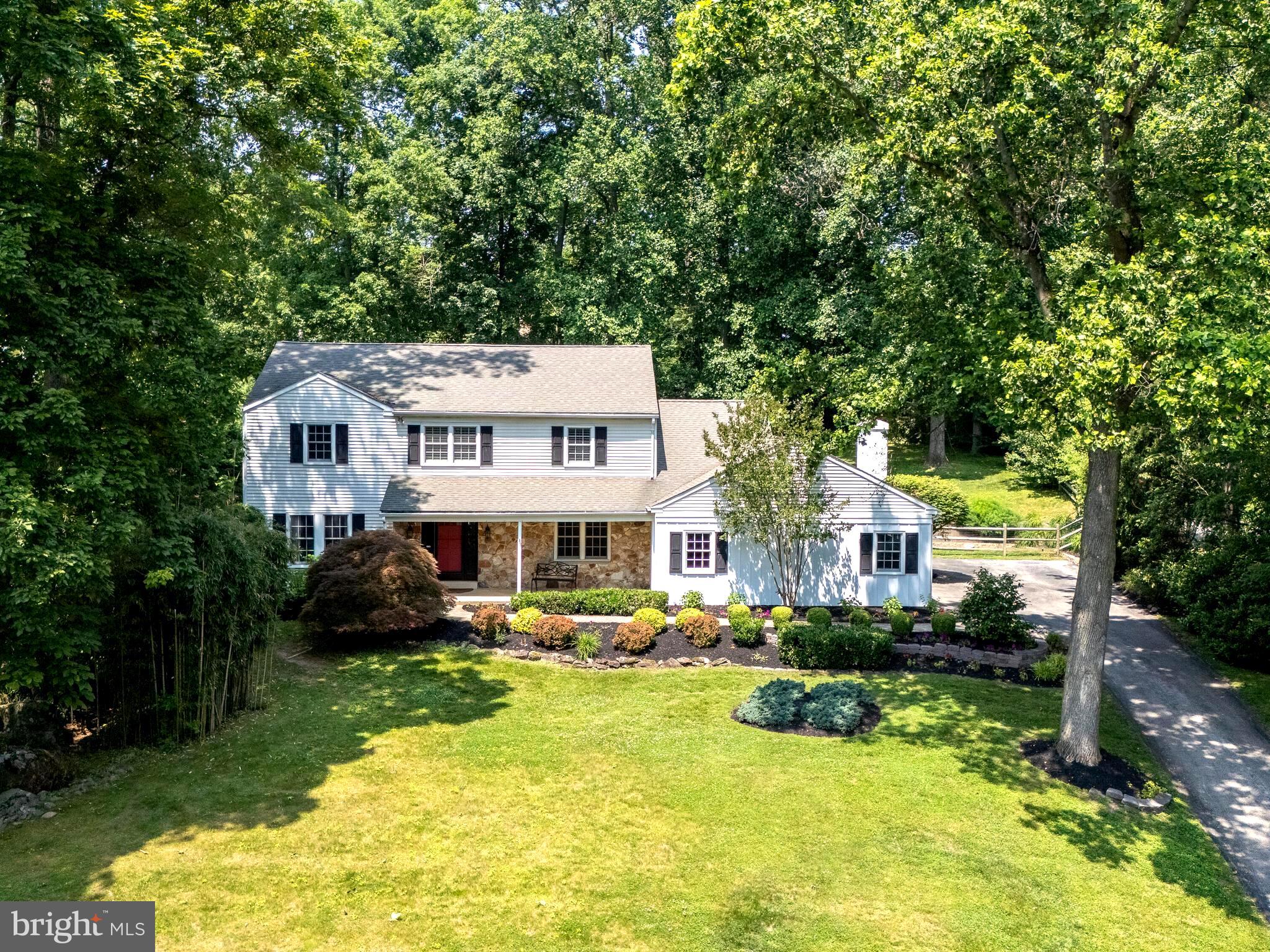 Move right in to this beautifully appointed Berwyn Colonial, where timeless style meets modern comfort. Thoughtfully maintained and designed with both elegance and everyday living in mind, this 4-bedroom, 2.5-bath home offers a perfect blend of sophistication and comfortable family living.
The bright and open first floor boasts quality hardwood floors, crown molding, and generously sized rooms that invite both formal entertaining and casual gatherings. A gracious living room and dining room frame the elegant entry, flowing seamlessly into a chef-friendly white kitchen with granite countertops. The adjoining great room showcases a wood-burning fireplace, to enjoy during the cool evenings, and French doors that open to a newly finished flagstone patio.
Upstairs, the spacious primary suite provides a serene retreat with a large walk-in closet and an updated full master bath. Three additional bedrooms with ample closets and a beautifully refreshed hall bath complete the second floor. The fully finished lower level offers versatile space for a media room, fitness studio, playroom, or entertaining - along with abundant storage.
Outdoors, the fenced backyard creates a private oasis for children, pets, and gatherings under the stars. The home sits on an elevated lot, offering a sense of privacy and seclusion within the neighborhood while being moments away from top-ranked Tredyffrin-Easttown schools, including Beaumont Elementary. Along with popular local dining, boutique shopping, golf courses, and country clubs, this home sits in the heart of everything the Main Line offers.