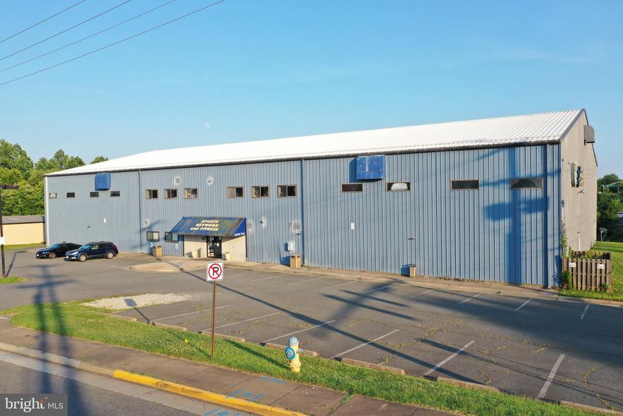 LOCATION - LOCATION - LOCATION! Excellent property for industrial and mixed use purposes. 1.84 Acres with well maintained all metal building. Boasting 20,718 sq. ft. of continuous heated and cooled floor space with 44 paved parking spaces and additional space for more. HVAC systems recently upgraded. Main entrance leads to lobby area with front desk, office and 2 bathrooms. Upper level includes cafe, offices/meeting space and viewing area. Multiple storage areas are located throughout the building. Upgrades also include roll up bay door (12x14), LED lighting and electronic signage. Location is ideal due to its high-traffic and high-visibility from Liberia Avenue, convenient location and multiple uses. Zoning is I-2 heavy industrial. Building can be modified to suit, current use is as a sports center. Sports business also for sale/lease. Please call to schedule private tour of facility. See docs for plans and additional details.  3D pics @  https://photos.app.goo.gl/csQWmrG2jC7refUm8