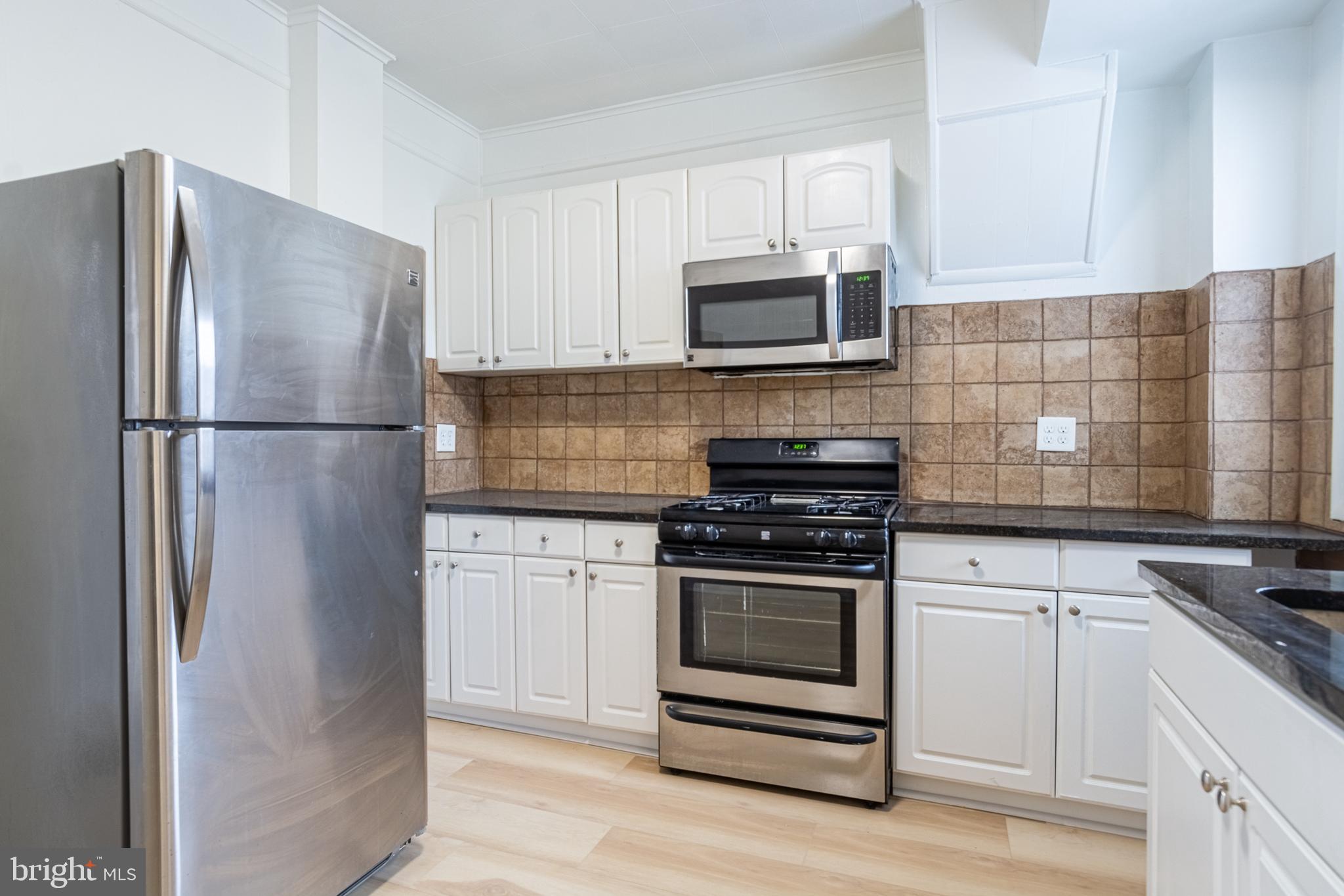 WHY RENT WHEN YOU CAN BUY THIS TURN KEY ROWHOME IN THE UP AND COMING REMINGTON NEIGHBORHOOD! Property is Lead Safe and move in ready! Features include hardwood floors throughout, an inviting living room, updated kitchen with granite counters, ss appliances, and tile backsplash, upper level with 2 bedrooms and 1 full bath with glass sliding doors, an improved basement with laundry area and tons of storage, and a rear patio! Location can't be beat - convenient to I-83, downtown Baltimore, and tons of Remington, Hampden, and Charles Village restaurants and shopping!