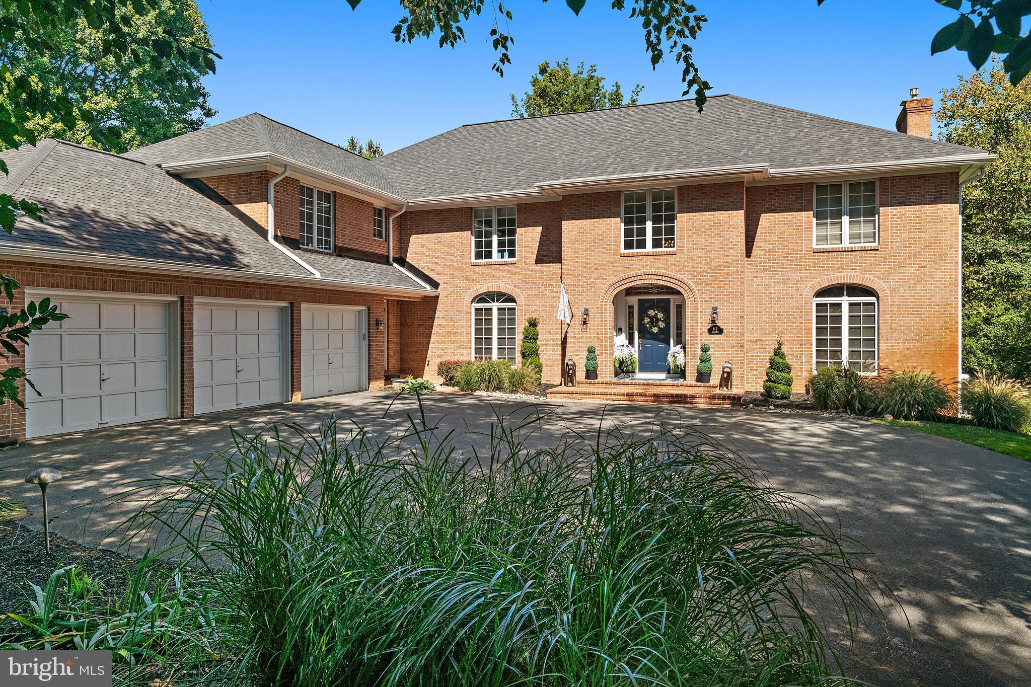 Welcome to 812 Coachway, an exceptional all-brick estate at the point of the coveted community of The Downs on the Severn River. Offering 6 bedrooms, 7 bathrooms, and more than 7,500 square feet, this residence has been thoughtfully updated by the current owners to combine timeless architecture with modern luxury. From every level, enjoy stunning Severn River views and multiple outdoor venues including patios, decks, and balconies that capture the essence of waterfront living.
Upon entering you'll be greeted by a two-story foyer with a classic staircase that opens to the office with custom built ins, a formal dining room, and a living room with fireplace and access to the sunroom. The gourmet kitchen features a modern induction cooktop with precision temperature control, stainless steel appliances, quartz counters, and a bay window breakfast area that flows seamlessly to the family room with fireplace and full bar, creating a perfect space for entertaining.
The upper level primary suite includes a fireplace, a brand new spa inspired bathroom with a wet room and luxury finishes, and sliding doors to a recently revamped private deck with dramatic water views. 4 additional bedrooms, including 1 with its own private deck, 3 full baths, and a convenient laundry room complete the upper level.
The walkout lower level offers a recreation room with fireplace, wet bar, and sliding doors to the patio and pool area. This level also includes an exercise room or additional bedroom and a full bath, making it ideal for guests or extended family. Expansive new decks, refreshed landscaping, a private pool, and fenced yard enhance the home’s outdoor living experience, all set against the backdrop of panoramic Severn River views.
The Downs is one of Annapolis’ most prestigious waterfront communities, celebrated for its privacy and and proximity to downtown Annapolis. Amenities include, two marinas with deep-water slips providing easy access to the Severn River and Chesapeake Bay, a clubhouse ideal for gatherings, a swimming pool with lounge areas, and tennis and pickleball courts, and so much more!