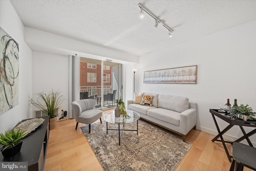 Experience elevated urban living in this sought-after one-bedroom condo, perfectly positioned in the heart of downtown Bethesda. Nestled between Bethesda Row and Woodmont Triangle, and just steps from the Metro, this sunlit residence offers both convenience and sophistication.

Designed with both style and function in mind, the kitchen boasts granite countertops, maple cabinetry, and stainless-steel appliances, flowing seamlessly into an open living space. Bathed in natural light, the living area extends to a spacious balcony, ideal for morning coffee or alfresco dining.

The spacious bedroom features new carpeting and a generous closet, offering plenty of storage. The bathroom is appointed with granite countertops, a maple vanity, and a freshly reglazed tub. Additional highlights include in-unit laundry, assigned garage parking, assigned storage locker, and newly painted throughout.

Immerse yourself in the vibrant energy of downtown Bethesda, where world-class dining, boutique shopping, and cultural attractions are just moments away. With effortless access to public transportation, commuting to Washington, DC has never been easier.