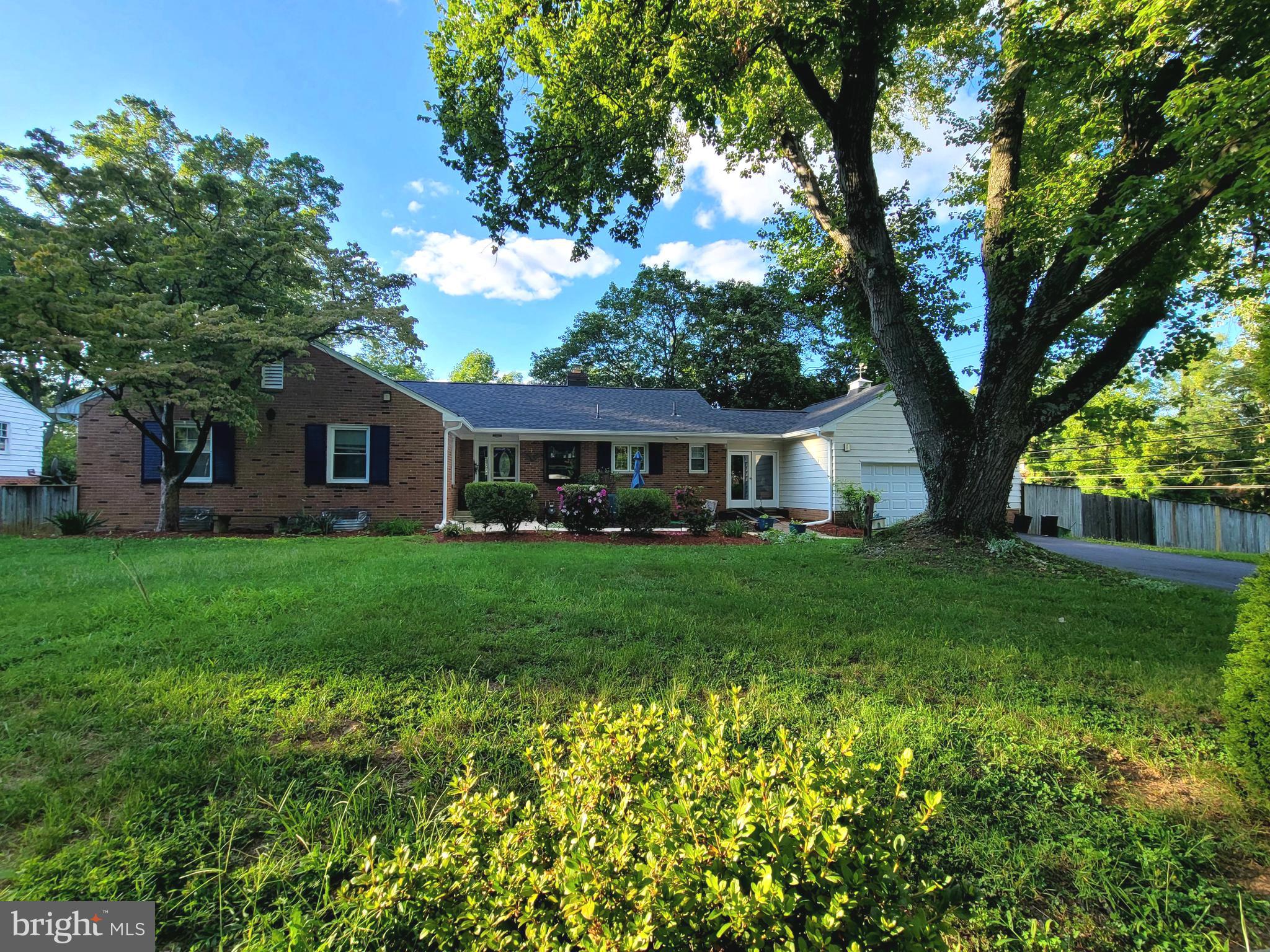 This delightful brick detached rambler boasts five bedrooms and zero HOA fees. Experience the benefits of a new roof and a two-year-old HVAC system. The main level features three bedrooms, a full kitchen equipped with stainless steel appliances and granite countertops, and a formal dining room that opens to a bright, glass-enclosed sunroom—ideal for use as an office. The inviting living room is highlighted by a wood-burning fireplace. The lower level includes three bedrooms, plus a den ,and two full baths.
A convenient kitchenette, along with a fully finished basement that offers another fireplace and a walk-out entry to a spacious fenced yard. The property also comes with a two-car garage and four additional driveway spaces. Perfectly situated, it provides easy access to the Ride On bus stop right outside your door, and Shady Grove Metro Station is just two miles away. MD 200 and the Rio Washingtonian Center are within a 10-mile radius, with grocery shopping, Bohrer Park, and the Community Center just minutes away. One room is currently rented until the end of November 2024. This home has previously been approved for childcare for up to 8 children and may also be suitable for assisted living for up to 10 patients. Sold "AS-IS".
