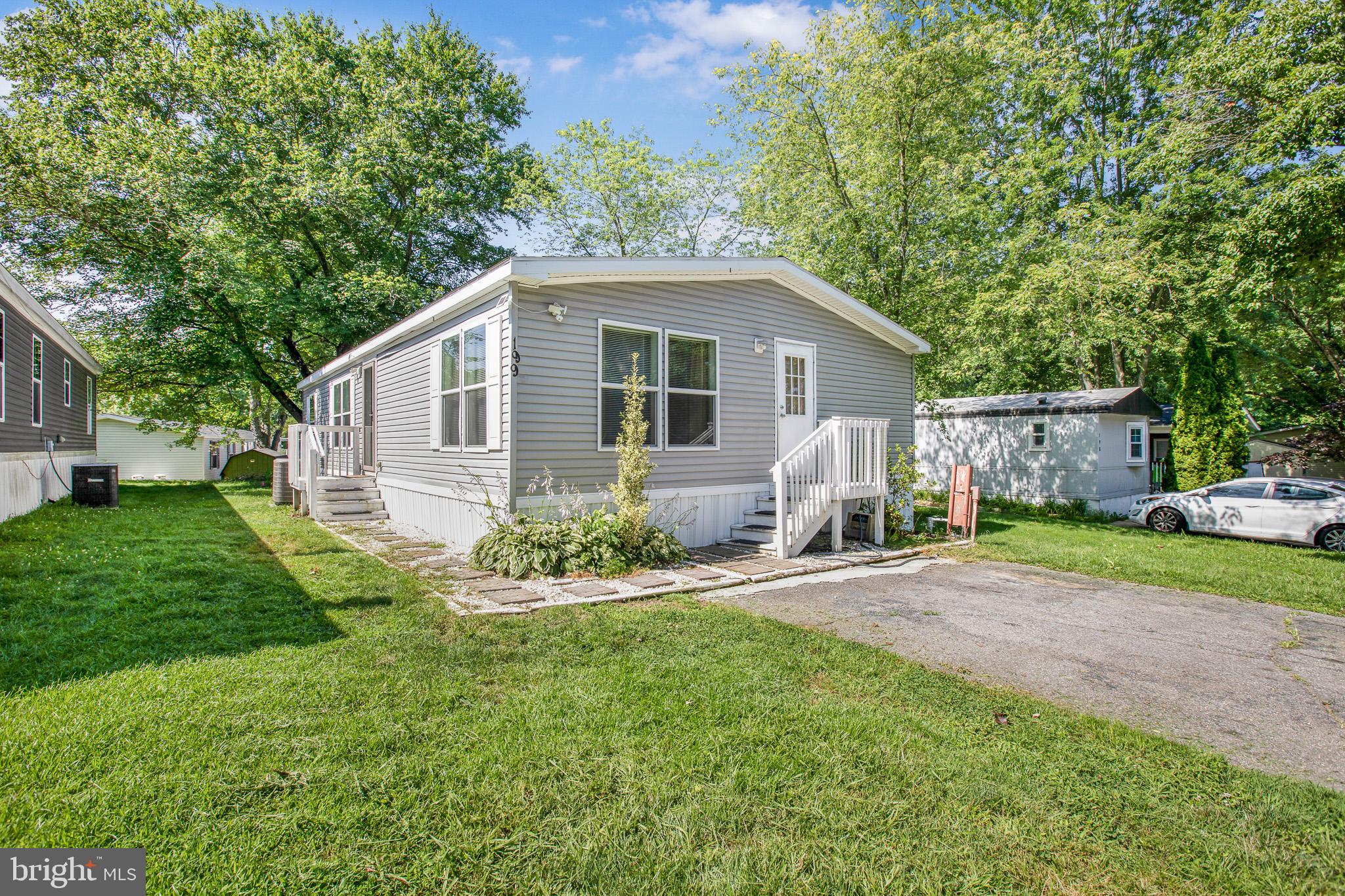 Built in 2015 and offered at just $120,000, this 3 bedroom, 2 full bath double-wide manufactured home presents an incredibly rare opportunity in today’s market. With over 1,100 sq ft of living space, this well-kept home includes a private primary suite with full bath and a driveway that fits two vehicles. Located in a well-managed Lothian community featuring a swimming pool, tennis court, basketball court, and tot lot. Water is included in the monthly community fee. Home qualifies for mortgage financing. Sale is subject to community approval. Affordable homeownership in Southern Anne Arundel County at a price point rarely seen this decade—schedule your showing today!
