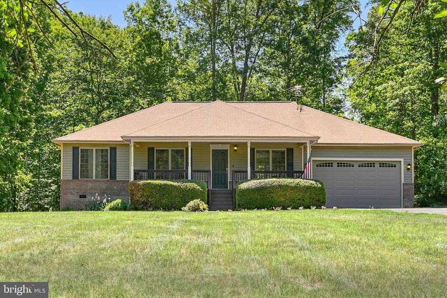 Welcome to easy lake living in the amenity-filled Windwood Coves community on the public side of Lake Anna! This well-maintained 3-bedroom, 2-bath one-level home offers the perfect combination of comfort, convenience, and outdoor enjoyment — all situated on a beautiful flat lot in a golf cart-friendly neighborhood.

Inside, the comfortable living area features a gas fireplace and vaulted ceiling detail that adds an open and inviting feel to the main living space. The functional floor plan also includes a dedicated laundry room and an additional flex space that would make an ideal home office, workout room, hobby space, or guest overflow area. Fiber optic internet is available, making remote work and streaming a breeze.

From the moment you arrive, you’ll appreciate the paved driveway, attached 2-car garage, covered front porch, mature landscaping, and inviting curb appeal. The spacious rear deck creates the perfect setting for entertaining, summer cookouts, or relaxing evenings around the dedicated firepit area. The property also features four apple trees, a storage shed, RV hookup, whole-home generator, and EV charger in the garage for added functionality and peace of mind.

Best of all, deeded boat slip #257 conveys, giving you quick access to enjoying life on the lake. Windwood Coves offers an impressive lineup of amenities including a sandy beach, boat launches, tennis courts, basketball court, volleyball area, picnic spaces, playground, and more — making every day feel like a getaway.

Conveniently located near local restaurants, wineries, grocery stores, and popular Lake Anna attractions, this property is ideal as a full-time residence, weekend escape, or investment opportunity. If you’ve been searching for low-maintenance lake living with community amenities and boating access, this one is worth a look!