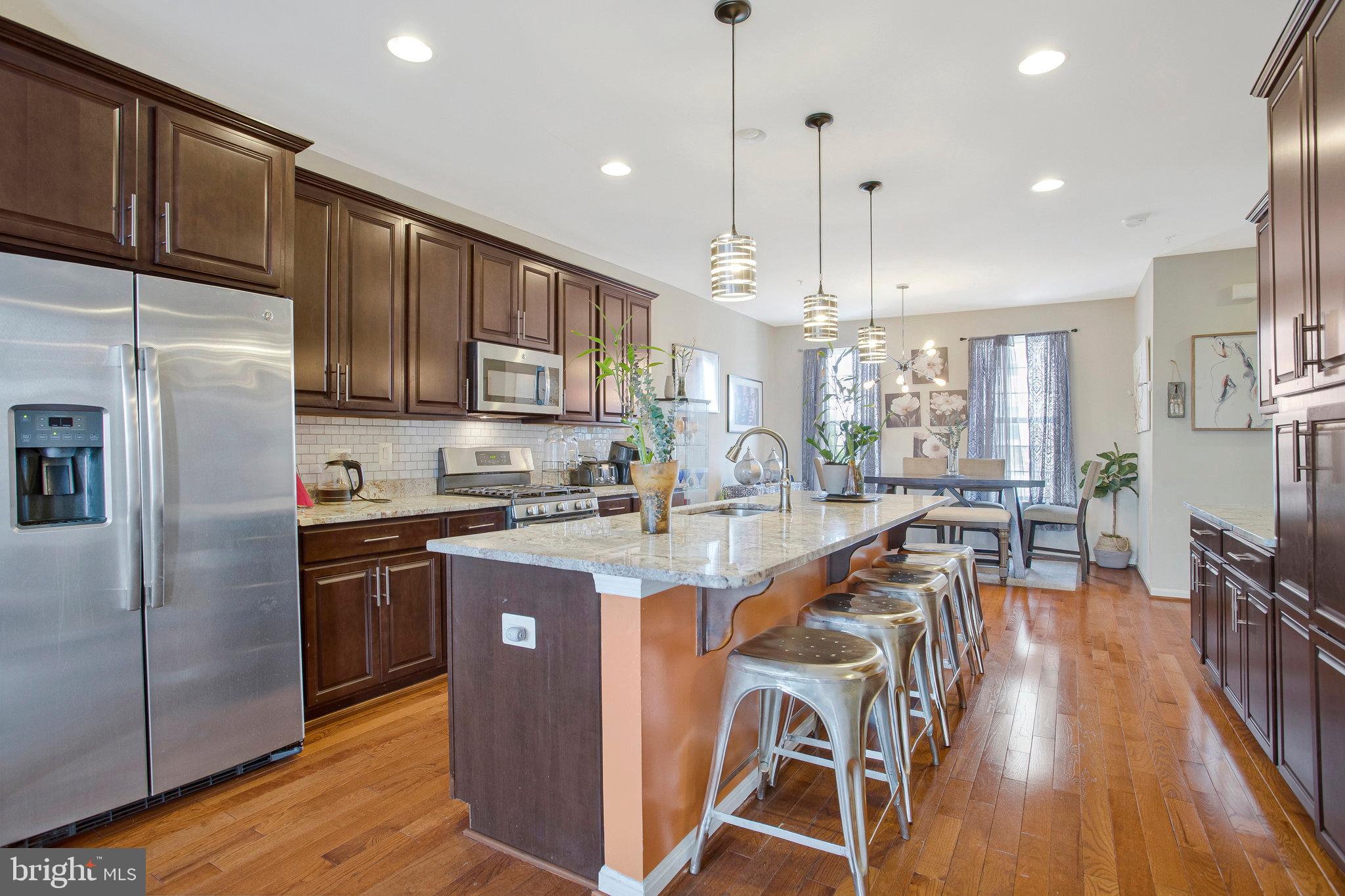 Beautiful 3-story home boasts all the modern features and amenities you desire in a new construction build. This home is nestled within a cozy enclaved community, zoned to Westowne Elementary, Catonsville Middle School, and Catonsville High School. From the moment you step inside, you will appreciate the pristine condition of this beautiful home. Upon entering the spacious foyer and hallway, you will find a private, rear-located, light filled room--perfectly used as a 4th bedroom, office, theatre room, or whatever your heart desires!
Ascending to an open-concept design --perfect for modern living--The main level features spacious living areas with an abundance of natural light and half bathroom. The kitchen is equipped with the stainless-steel appliances and features an oversized island that is perfect for entertaining or just enjoying a casual meal. The living room is adjacent to the kitchen and features a gas fireplace with access to a relaxing deck overlooking lush greenspace.
You'll enjoy the tranquility that the upper level provides. Three bedrooms, two full bathrooms (with double sinks in each bathroom), and laundry room provide sought-after conveniences of the bedroom level. The primary suite boasts an impressive tray ceiling, spacious walk-in closet with a relaxing ensuite bathroom containing a soaking tub and separate shower. Additionally, this home is conveniently located within a short drive to shops and restaurants in the heart of Catonsville and Ellicott City. Easily accessible to nearby 695, I-95, MARC, and BWI airport.