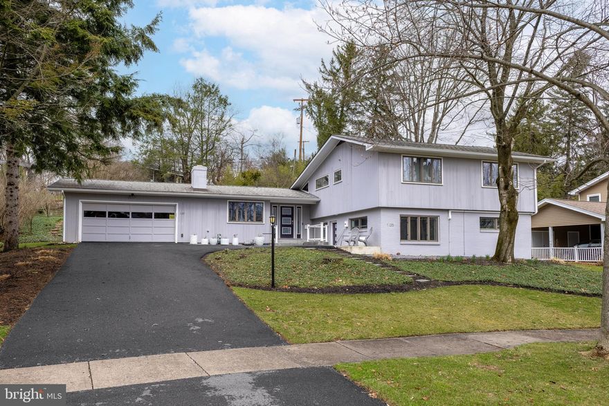 OPEN HOUSE - Sunday, March 29th, 12:00 - 1:30 PM. You will be delighted when you step inside this remarkable Holmes-Foster home. Beautifully remodeled and thoughtfully presented, it is sure to impress.
The main floor offers versatility, featuring a cozy seating area in front of a wood-burning fireplace, adjacent to an ideal dining space. The kitchen is both efficient and luxurious, showcasing a tile backsplash, new high-tech stainless steel appliances, and stunning oversized tile flooring that ties in with the rest of the home. Custom shelving and beautiful wood cabinetry provide ample storage. The ultimate gathering space, located opposite the kitchen, offers an additional seating area and a spacious living room with vaulted ceilings, an accent wall, and access to a screened-in patio. Upstairs, there are three bedrooms with updated ceiling fans and lighting, along with two full bathrooms—both featuring tiled shower surrounds and modern finishes.
The lower level provides additional flexible space for living, hobbies, or a home office, complete with built-in shelving. Gardeners will love the terraced beds in the backyard. One of the nicest attached apartments you’ll find in the borough offers endless possibilities—whether for rental income (short- or long-term), out-of-town guests, a private home office, or multi-generational living. All of this is conveniently located near Penn State University, schools, and shopping, in one of State College’s most sought-after neighborhoods.