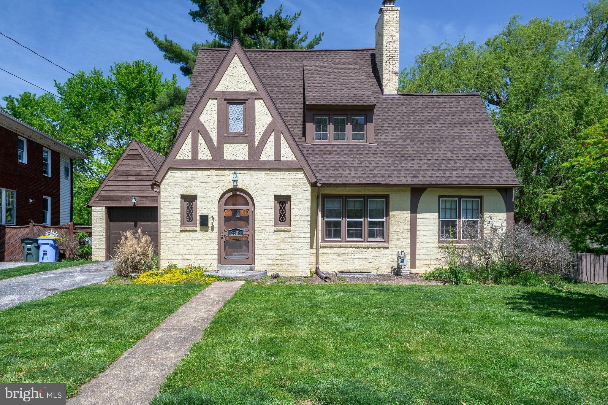 Don’t miss this charming 2-bedroom, 1.5-bath Tudor-style home offering 1,541 sq ft of living space on a large 0.37-acre lot. Beautiful hardwood floors run throughout the home providing warmth and timeless character. The main level features a bright and spacious living room with a cozy wood-burning fireplace, a formal dining room with an elegant bay window, and a kitchen with durable tile flooring and gas range. The main floor also includes a convenient laundry area and half bath, with room to convert to a 2nd full bath. Upstairs features two bedrooms, one with a walk-in closet, along with a full bathroom. Enjoy a fully fenced-in backyard with large concrete patio and mature trees, ideal for entertaining. Recent upgrades include a new architectural shingle roof, gas forced air furnace, gas water heater, and updated 100-amp electrical service. The 1-car garage has a brand-new door and lift motor for added convenience. Schedule your private showing today!