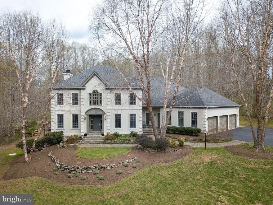 OPEN SUNDAY 4/14 FROM 1-4**This custom designed and built Transitional Colonial is located in THE ENGLISH HILLS one of Fairfax Station s finest communities. Step inside and you will be impressed by the open exciting floor plan design. Enhanced with architectural details, this home features three finished levels tall ceilings, gas fireplace with custom built-ins, generator, two zone HVAC systems, designer d cor, numerous recessed lighting and gleaming hardwood flooring.The main level includes a two story open foyer, spacious chef s kitchen with granite counter tops, natural cherry cabinets, built in desk, two wall ovens, five burner gas cooktop, refrigerator with icemaker, dishwasher, a large sun filled breakfast room with boxed bay window seat, family room with french doors, palladium windows, gas fireplace with built- ins, main level powder room, formal living room, lovely gracious dining room and a main level guest bedroom/den with full bath.Just a few steps from the kitchen area you will find an additional front entrance with back foyer, laundry room and second staircase up to bedroom level.  Up the staircase to the fabulous bedroom level where you can relax in the open loft/bedroom area The master suite with spacious walk in closet, designer bath with two vanities, large glass tile shower and soaking  Jacuzzi  tub and skylight. There are two additional spacious bedrooms each with their own full bath. No stone has been left un-turned to compete this fabulous home, the lower level has ample space for all, a game room, recreation room, and party bar with built in  cabinets plus an spacious additional bedroom and  full bath and HUGE storage area. This extraordinary private five acre estate features circular driveway allowing for easy entrance and exit to home. Extensive landscaping, stone walkways, stone retaining walls,  mature trees and abundant wildlife. This home is perfectly sited with wooded views from every vantage point. Enjoy peaceful evenings and cool afternoons on your spacious multi- level deck.  You can vacation at home in your in-ground heated pool complete with waterfall and hot tub/spa.Welcome HOME!