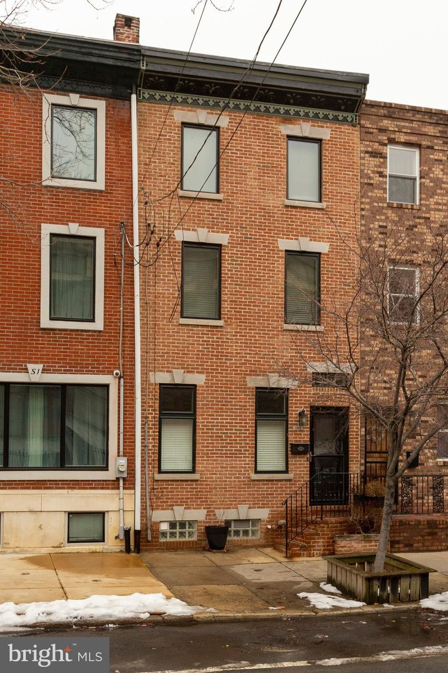 Extra large and super sunny 3 bedroom, 2.5 bath Hawthorne home with plenty of character and lots of updates throughout! Hardwood floors, exposed brick, crown moldings, sliding glass doors, large rear yard and a third floor balcony are just a few of the wonderful things that will make you fall in love with this home! Wide open bright first floor with galley kitchen, granite countertops, stainless appliances, charming pantry and nice size rear yard. Second floor has two big bedrooms and an extra large hall bath. Third-floor master bedroom with en suite bath, glass stall shower, separate tub, vaulted ceilings and a private rear balcony. Basement is super clean with powder room, laundry and mechanicals. Steps away from the Broad Street line, Italian market, Center City, restaurants, shopping and so much more!