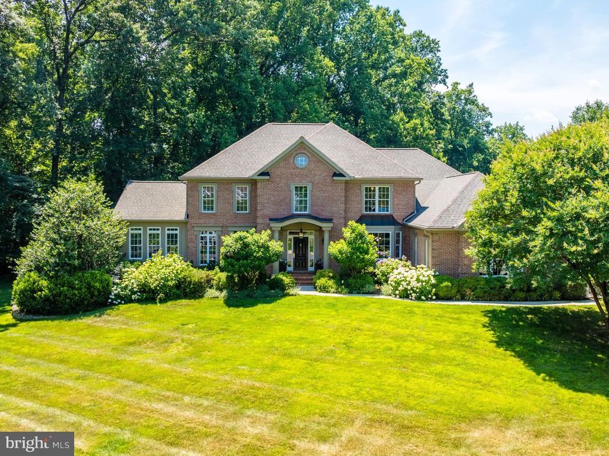 A rare opportunity awaits in the sought-after Fox Run community. Nestled within an enclave of 30 homes framed by mature trees, this walkable neighborhood is surrounded by nature and adjacent to Turner Farm Park. This true center hall colonial features a foyer flanked by formal living and dining rooms, with a seamless flow throughout the light-filled rooms, including a sunroom with a cathedral ceiling and walls of windows.

Enter into a two-story foyer leading to a stately great room with a coffered ceiling, a stone raised hearth fireplace framed by large windows, and a wall of built-ins. The study, nicely tucked away for privacy, boasts a large bay window with great views. A wonderful bonus is the sunroom with its cathedral ceiling and walls of windows. The thoughtfully designed chef's kitchen features cherry cabinets, granite countertops, and stainless steel appliances. The spacious breakfast nook includes a large bay window and a French door leading to the expansive backyard with a bluestone patio. The main level is completed by a mudroom and a three-car garage.

The upper level offers a large owner's suite with a cathedral ceiling, a luxury bath, and his-and-her walk-in closets. Additionally, there are four secondary bedrooms with a Jack and Jill bath and a hall bath. The walkout lower level is a showcase with a large recreation room featuring a fully equipped wet bar and media nook with a gas fireplace, a playroom or exercise room, walls of built-ins, an entertainment closet, and a sixth bedroom with a full bath. The basement is completed by an oversized laundry room and a utility room.

Located just minutes from Great Falls Village, Tysons Corner, the Silver Line Metro, Reston Town Center, and Dulles International Airport, this home offers unparalleled convenience and luxury.