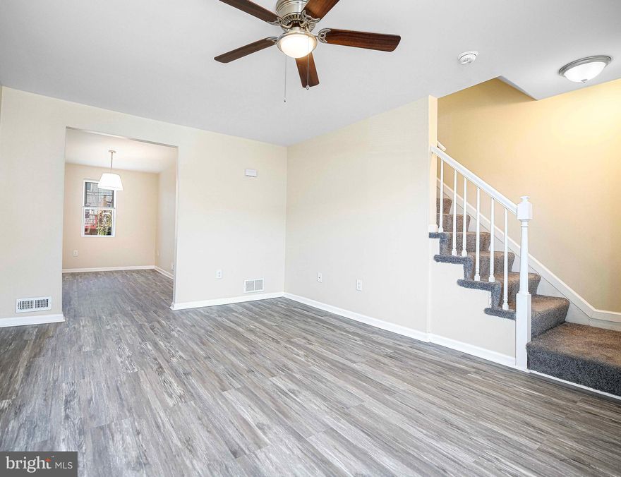 This stunning end of group rowhome features many recent updates.  LVP flooring throughout, new cabinets and granite countertops, stainless steel appliances, and new paint give this home a bright and modern feel.  However, the real value is in the details.  All of the windows have been replaced, new doors, new HVAC, and new washer and dryer make this home truly move in ready.  On the upper level, the bathroom has been updated with a new tub/shower, toilet and vanity.  The lower level has been freshly finished with new flooring and paint and provides ample space to spread out.  A brand new deck walks out to the rear yard that includes a shed and a private parking area.  This home is just minutes away from the famed Pimlico race track and is a great convenient location to get downtown!