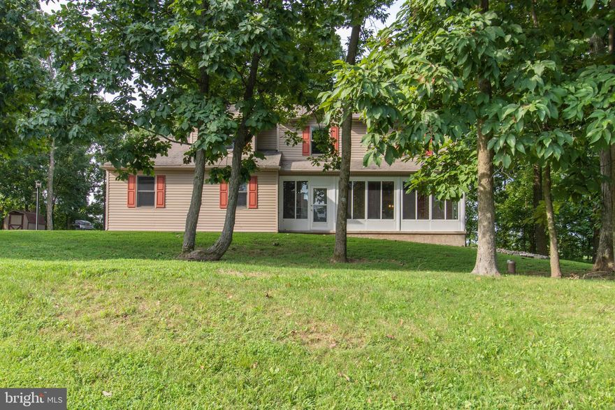 WOW, absolutely stunning 5 bedroom 3 full bath house on 2 acres that is nicely updated. Enter the house through the new front door into the foyer with Hardwood flooring that runs into the living room. The open Eat-in kitchen has been updated with newer cabinets, granite countertops, tile flooring and stainless steel appliances. All three bathrooms have also been updated with tile flooring, newer vanity tops and paint. All five bedrooms have newer carpeting, paint and six panel doors. The large master suite has a private master bath with double sinks. The other three bedrooms are spacious with plenty of closet space. The 5th (first floor) bedroom/family room could be used as an in-law suite-It boasts a private bath, walk-in closet and private entrance. First floor laundry area with cherry cabinets  for storage. The house sits on a private wooded 2 acre lot. There are 2 sheds on the property for storage along with the two-car attached garage. Large driveway for plenty of off-street parking. There is an enclosed front porch for privacy. This house has everything a new owner would want. Make your appointment today, this one will not last.