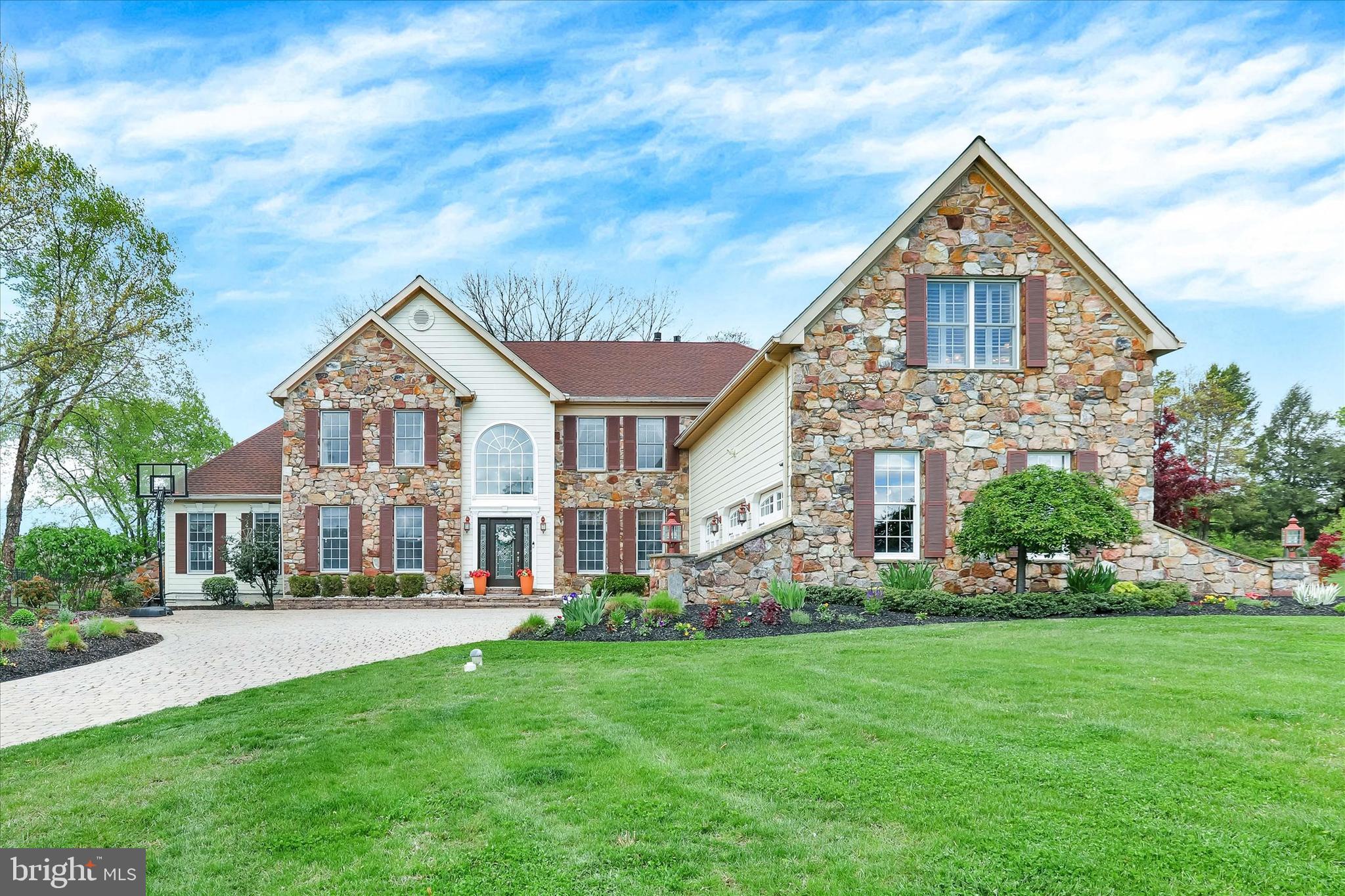 Premium EVERYTHING in this Dolington Estates ‘Sterling Collection’ home with over 7600 sq feet of finished living space. Starting from the beautiful premium cul-de-sac 1.05 acre lot, backing to 100 acres of preserved, organic farm land. Drive up the gorgeous paver driveway with expansive parking courtyard, to the stately stone front and Hardie Plank sided home with three car garage with designer doors. Enter the soaring two-story foyer filled with tons of natural light, custom marble tile flooring and turned staircase. From here follow this beaming natural light into the flowing entertaining floor plan. The living room, dining room to the left have two-step molding and gleaming hard wood floors. These two rooms access a great solarium with vaulted ceiling and wonderful 180 views of nature and the southern sun's warmth. The gourmet kitchen has an abundant amount of cabinet space, massive pantry and eat-in area that opens the the expanded great room with natural tile flooring, beautiful stone fireplace and two stories of massive windows and views of the inviting in-ground pool and farmland. A main floor study and a main floor bedroom with private full bath, a laundry room and powder room complete this main level. Make your way up the front or rear staircase to a hard wood floor landing/hallway that leads to a master suit that contains a sitting area, fireplace, coffered ceiling sleeping area, two large walk-in closets, bathroom with large soaking tub, oversized shower, double sink and private comode. The wood floors with inlay accent flows to the other spacious three spacious bedrooms. Two that share a jack-n-jill bathroom and the other has own princess suite full bath. walk-in closets and again - sun and private views are part of these spaces. WHEWW! – But you aren't done yet....Make your way to the best part! A custom designed finished lower level that will take your breath away. The lower room contains a fabulous entertaining movie theatre space, a second office/flex space, 6th Bedroom adjoining a full bathroom, a large workout room with mirrored walls, storage area, and a 2nd kitchen with refrigerator, dishwasher, sink and island. This level exits gracefully to the back yard and pool, with an open air stairwell to expansive paver patio spaces for great entertaining while you take dips in the heated salt water pool. Metal fencing contains the back yard areas, with an open area to run and play, with unimpeded farmland views. The true premium package customized like no other and includes a heated garage, new upgraded generator, Sonos home sound system and new HVAC Systems. This beautiful home will go quickly, do not miss!!