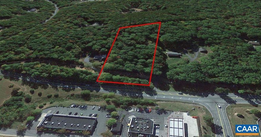 Great building lot on 2.0 wooded acres, located just outside of Lake Monticello, immediately across the street from local conveniences including grocery store, food, retail, and banking - so close you can WALK. All with no HOA! Perked for 3BR Conventional septic Sept 2023.