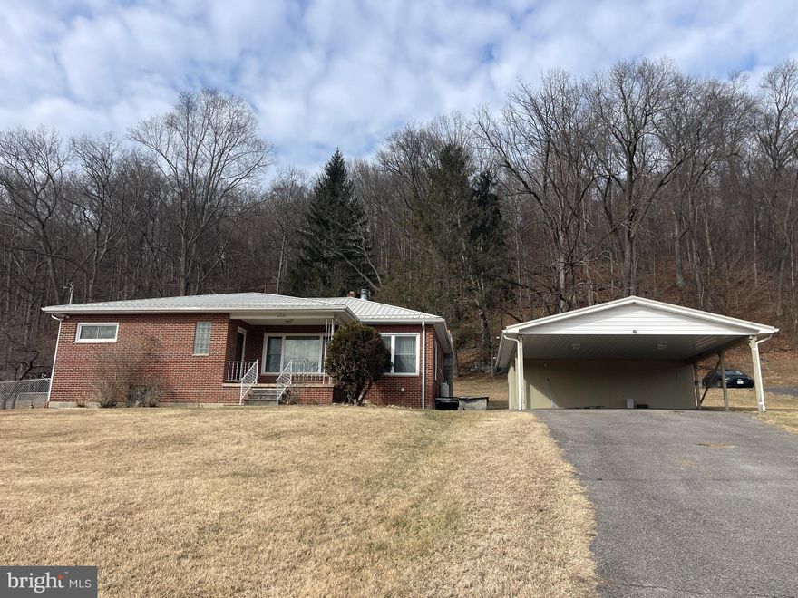 Discover the charm of this delightful ranch-style home, nestled on a generous 1.4-acre lot. Built in 1961, this well-maintained brick residence offers a warm and inviting atmosphere, perfect for creating lasting memories. With 1,442 sq. ft. of finished space, the layout features three spacious bedrooms and one and a half bathrooms, newly installed furnace, partial fenced yard, offering relaxation and comfort.  Outside, the paved driveway leads to a detached carport with space for two vehicles. Surrounded by nature, this property offers a peaceful retreat while remaining close to local amenities. Embrace the opportunity to make this charming home your own, where comfort and tranquility await.