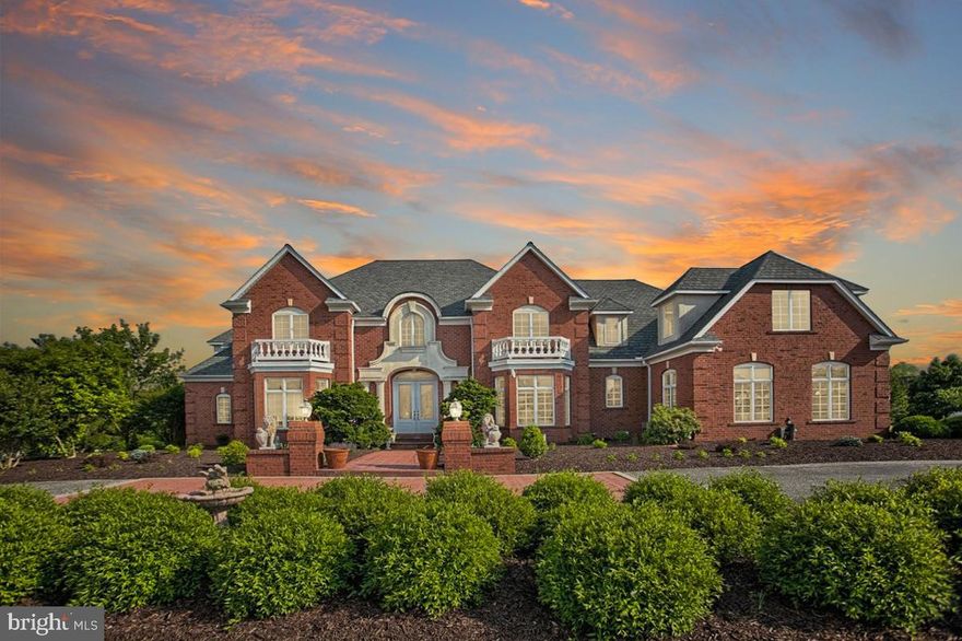 Here is a chance to own a one-of-a-kind exquisite residence situated on a 3.8 acre lot! From the striking solid-brick exterior to the imported granite, soaring ceilings, crown molding and artisan hardwood, no detail has been overlooked in the creation of this one-of-a-kind home. Grand double entry doors welcome you into the home where a light-filled two-story foyer awaits with statement columns, feature archways and gorgeous marble flooring. There are a host of opulent gathering spaces to suit any mood and occasion whether you’re hosting guests in the dining room, with a glittering chandelier, relaxing in the formal family room or unwinding in front of the fireplace in the awe-inspiring great room. Anyone with a passion for food and entertaining will feel drawn to the impeccable chef’s kitchen with sweeping stone countertops, custom cabinetry, high-end appliances, a center island and an open sun-soaked breakfast nook with oversized windows. There is a main-floor office, with custom built-in bookshelves, where you can comfortably work from home while the living space extends to the full finished walk-out basement. This incredible layout also offers six bedrooms, five full baths and two half baths including the first-floor master suite with a fireplace and direct access to the deck. Four bedrooms are housed upstairs and one is nestled in the basement, perfect for accommodating visitors. Tour to the lower level you will find ample living space, a FULL size kitchen and eating area, a spa room, a bedroom and movie theatre with all items to convey!  This is an entertainer's delight! Enjoy hosting and walking out to your lavish manicured yard. As you would expect in a home of this caliber, the list of extra features is simply breathtaking. There’s a three-car garage, six-zone heating and cooling and an owned solar panel system that will convey. Outside, you can bask in the sunshine on the deck or relish endless hours of summertime fun in the sparkling pool and hot tub, enveloped by hardscaping. This all-brick home stands proud within a prestigious neighborhood close to schools and picturesque parks while the vibrant center of York is within easy reach.