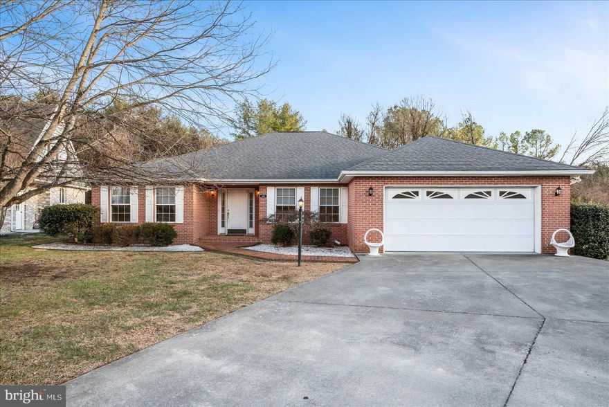 Exceptional opportunity to enjoy one-level, low maintenance living in this all-brick rancher nestled in beautifully maintained neighborhood across from the Medical Center.  Finished basement provides additional  bedroom and full bath for guests or family. One-owner home with recently updated HVAC and tankless water heater.  Level basement walkout opens to back yard backed by trees.