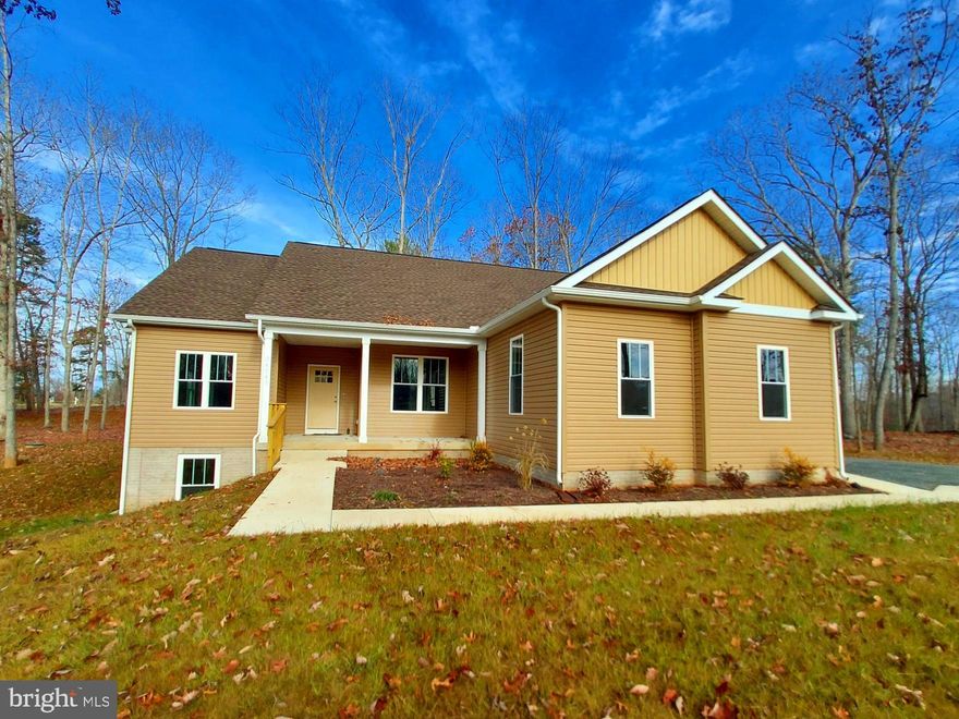 Gorgeous brand-new split-floorplan ranch recently finished in October 2023!  Lovely 2.37 acre lot with easy access to Locust Grove, Culpeper, Fredericksburg or Orange.  1553 finished square feet with luxury vinyl plank flooring, vaulted ceilings, high-end touches, and custom hand-laid ceramic tile showers & baths. You'll love the open floor plan, plus "soft close" cabinets & granite counters. High quality stainless appliances. Spacious & open family room has fireplace and cathedral ceiling.  Separate laundry & pantry.  2 car garage w/opener. Master suite, porcelain tile bathroom, and walk-in closet. Full walkout basement w/bath rough-in & windows for extra rooms. <b>HIGH SPEED INTERNET OPTIONS AVAILABLE:  Xfinity cable or FiberLync fiber optic. </b> You'll love the life in the country, but will still have easy with access to modern amenities throughout the Virginia Piedmont--arts and cultural exhibits, parades and festivals, shopping, dining, schools and easy access to major airports and metropolitan areas (DC, Richmond, Charlottesville) via  U.S. Routes 3, 15, 522 and I-64 and 95.  Major medical centers of Mary Washington, University of Virginia, Martha Jefferson Hospitals within an hour's drive. Experience the many local eclectic restaurants, breweries and wineries, or spend a day exploring museums, quaint towns,  and historic sites steeped in Americana. Outdoor recreation also abounds, <u>20 minutes to Lake Anna State Park</u>. Lake Orange and the Blue Ridge Mountains nearby for hiking, fishing, swimming, kayaking and boating.  <B>High quality homes like this are hard to find, especially at this low price per square foot--you won't be disappointed!</B>