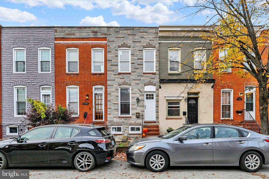 Gorgeous recent renovation of a larger-than-typical Locust Point row home on sought-after Andre Street, a charming tree-lined street with easy access to Latrobe Park, Fort McHenry, McHenry Row, and major commuter routes. This unique 2-bedroom, 2.5-bath home provides that classic Baltimore charm with extensive modern upgrades throughout, featuring exposed brick walls, dark hardwood floors, and an open-concept main level. The oversized kitchen offers espresso cabinetry, granite counters, a large entertaining island, and stainless steel appliances. A spacious mud/laundry room with a half bath adds convenience and extra storage.  The finished lowest level was recently transformed and carefully excavated to increase the ceiling height allowing comfortable living space to be added to the home.   This is an extremely unique feature within the community!

Upstairs, the generous owner’s suite includes a walk-in closet, spa-like bath with double vanity, skylight, and access to a rooftop deck with breathtaking city and harbor views. A second bedroom and modern hall bath complete the upper level. Enjoy a private parking pad, easy access to parks, shops, and dining—all in one of Baltimore’s most desirable waterfront neighborhoods. Tasteful updates throughout in one of Baltimore’s most sought-after communities, schedule your tour today!